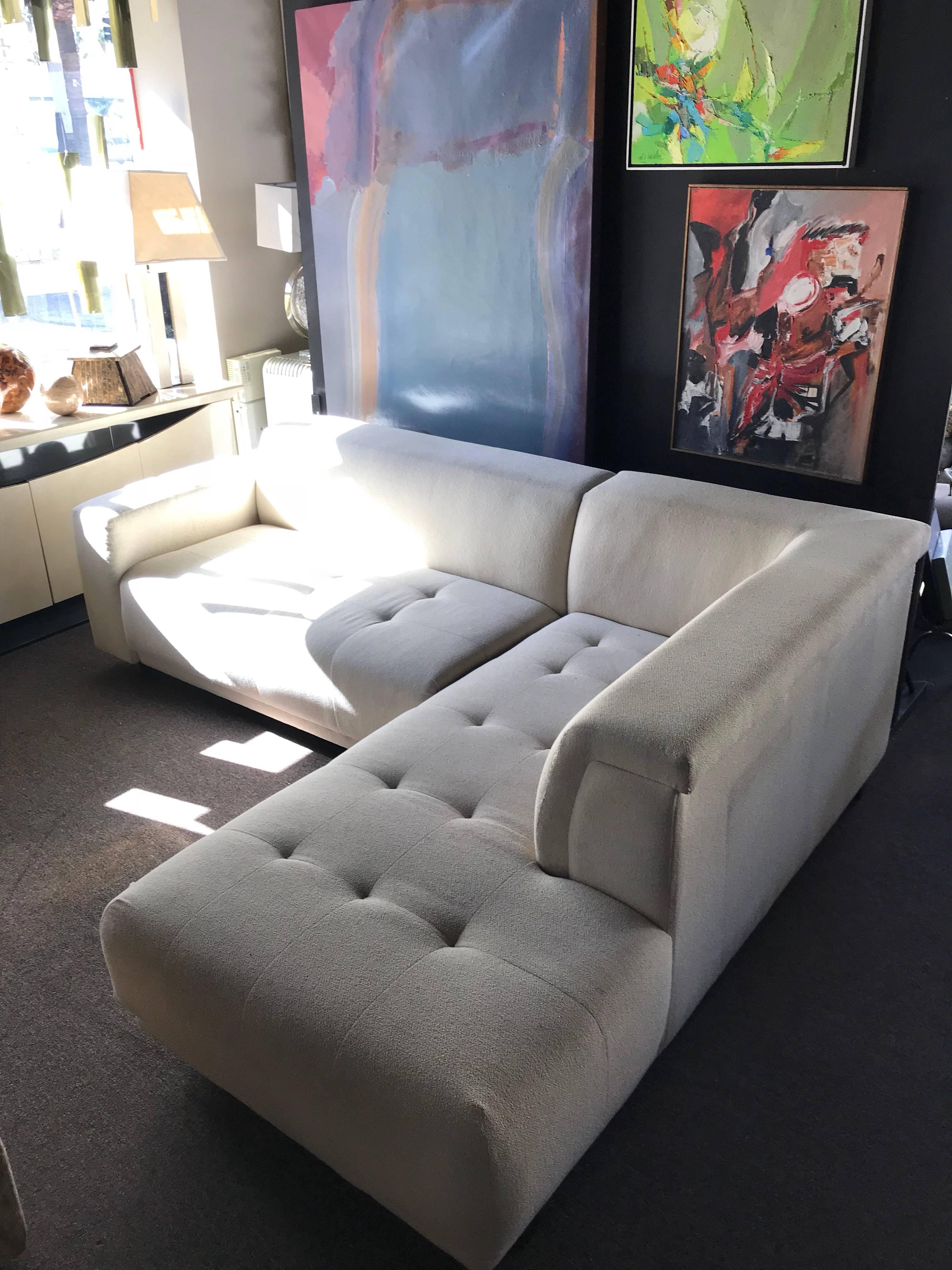 A very sleek and sexy crème color high end chenille fabric two-piece sectional. Made in the early 1990s by Lazar, a high end makes based in the USA. Second piece 77