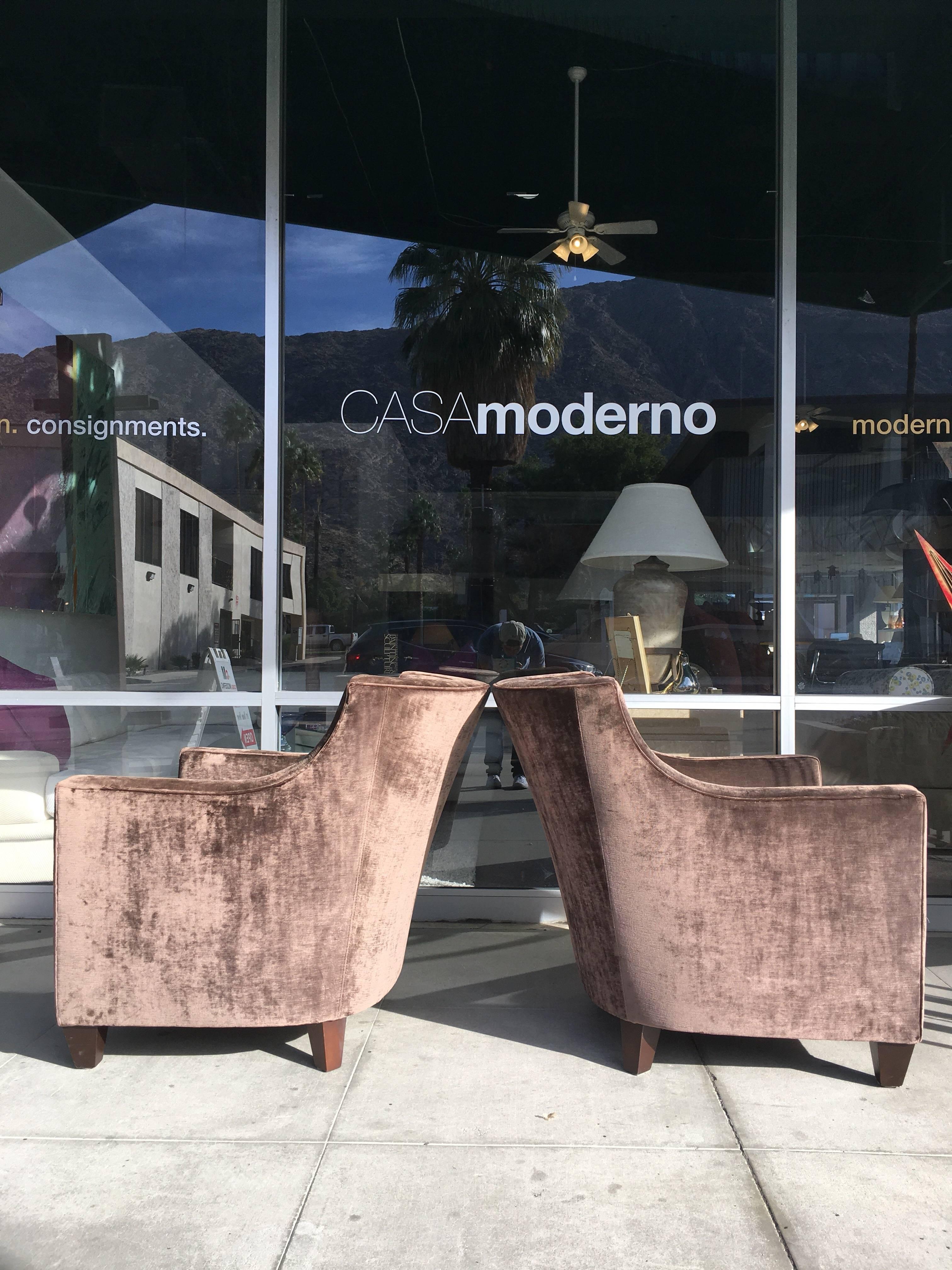 These very sexy pair of club chairs were custom-made by Robert Allen in the USA. They are covered in a gorgeous mink color antique velvet that has beautiful depth. Walnut wood feet. Seat cushion is not attached. Styling is a Modern Art Deco /