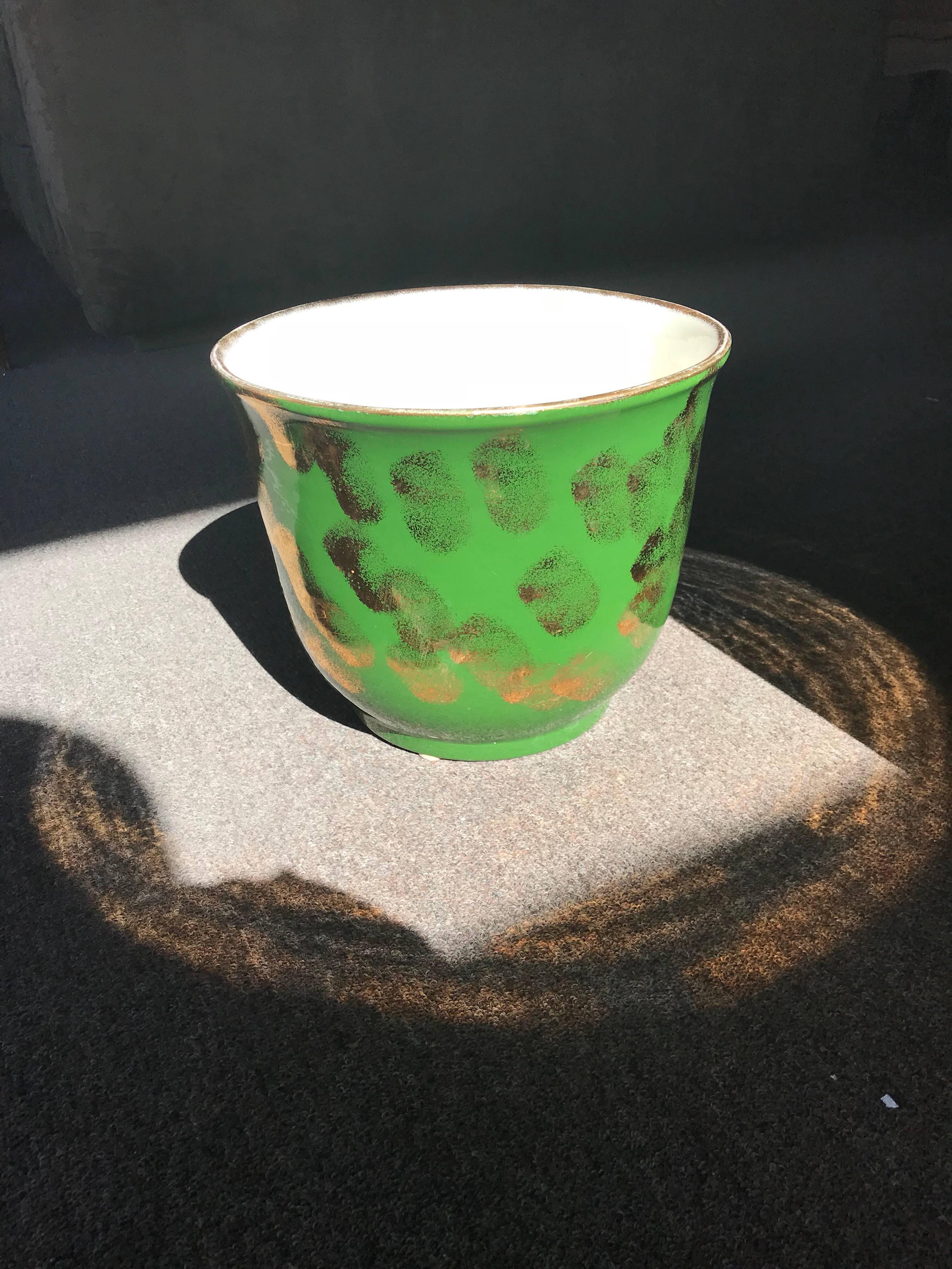 A gorgeous green and metallic gold jardinière (flower pot/planter) done by PPP (signed) the name of Pacific Pottery was famous in the 1950s-1970s for their modern, artistic pottery. This piece came from a beautiful, vintage Palm Springs Estate and