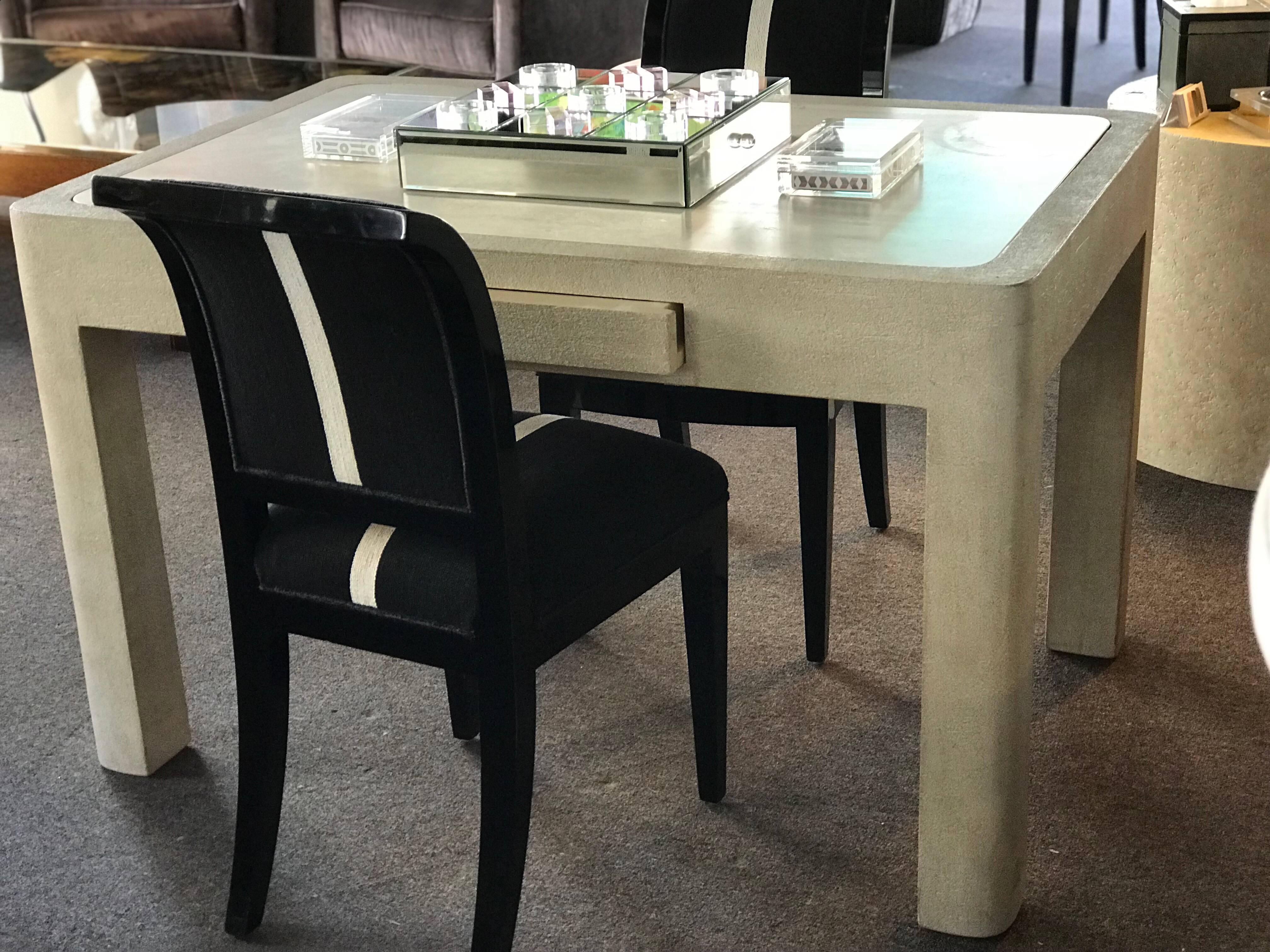 A custom one of a kind game table from the Rancho Mirage estate of Barbara Sinatra. This beautiful wood base has a plaster look finish, topped off with a beautiful Italian Travertine. Very much in the style of Karl Springer, who also had done some