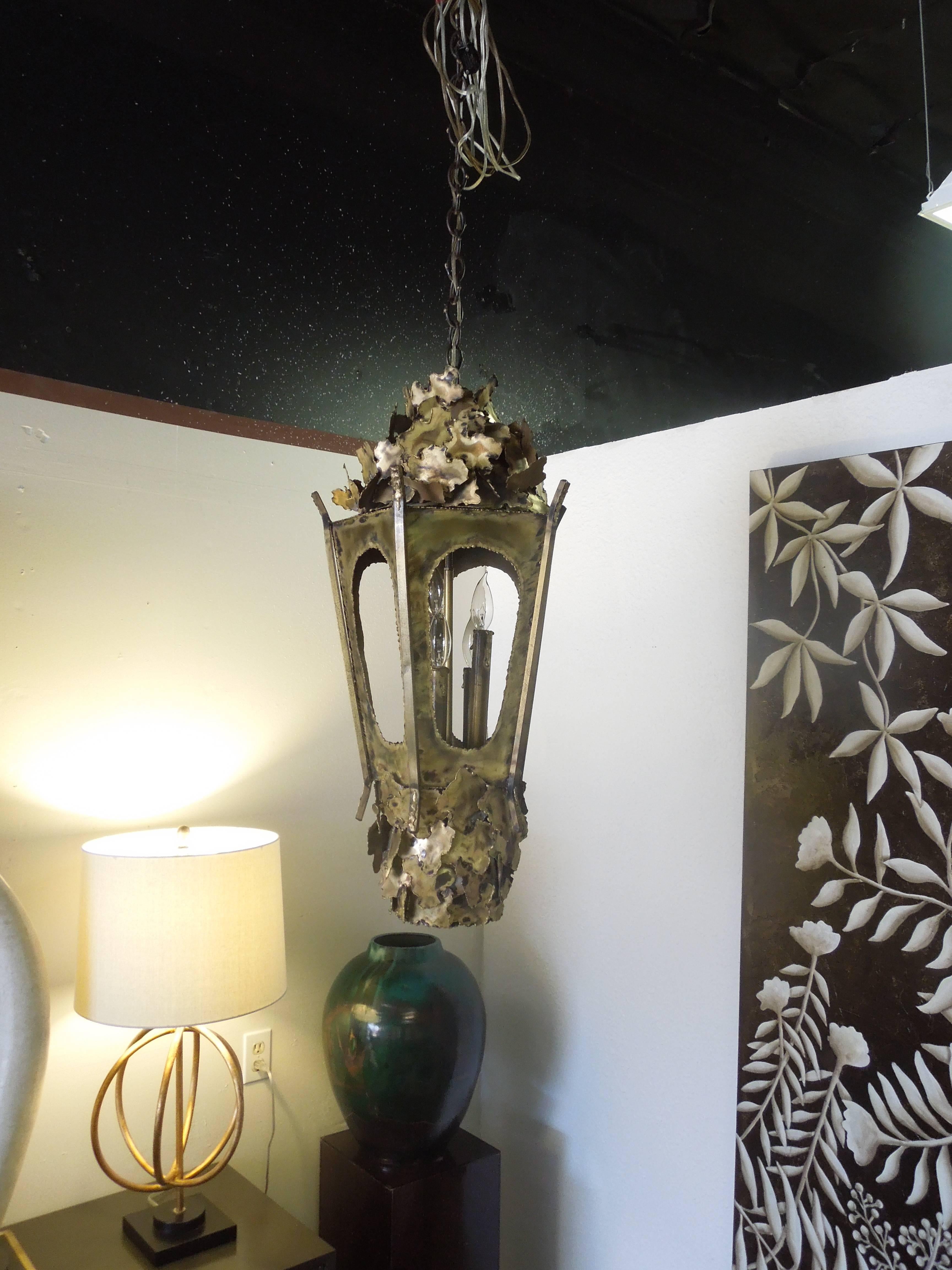 From a vintage Palm Springs estate, used above a game table, a large, beautifully shaped, iconic brutalist lantern style five-light chandelier by Thomas Greene. Four chandelier bulbs inside body and a wonderful rare spot on bottom of fixture to