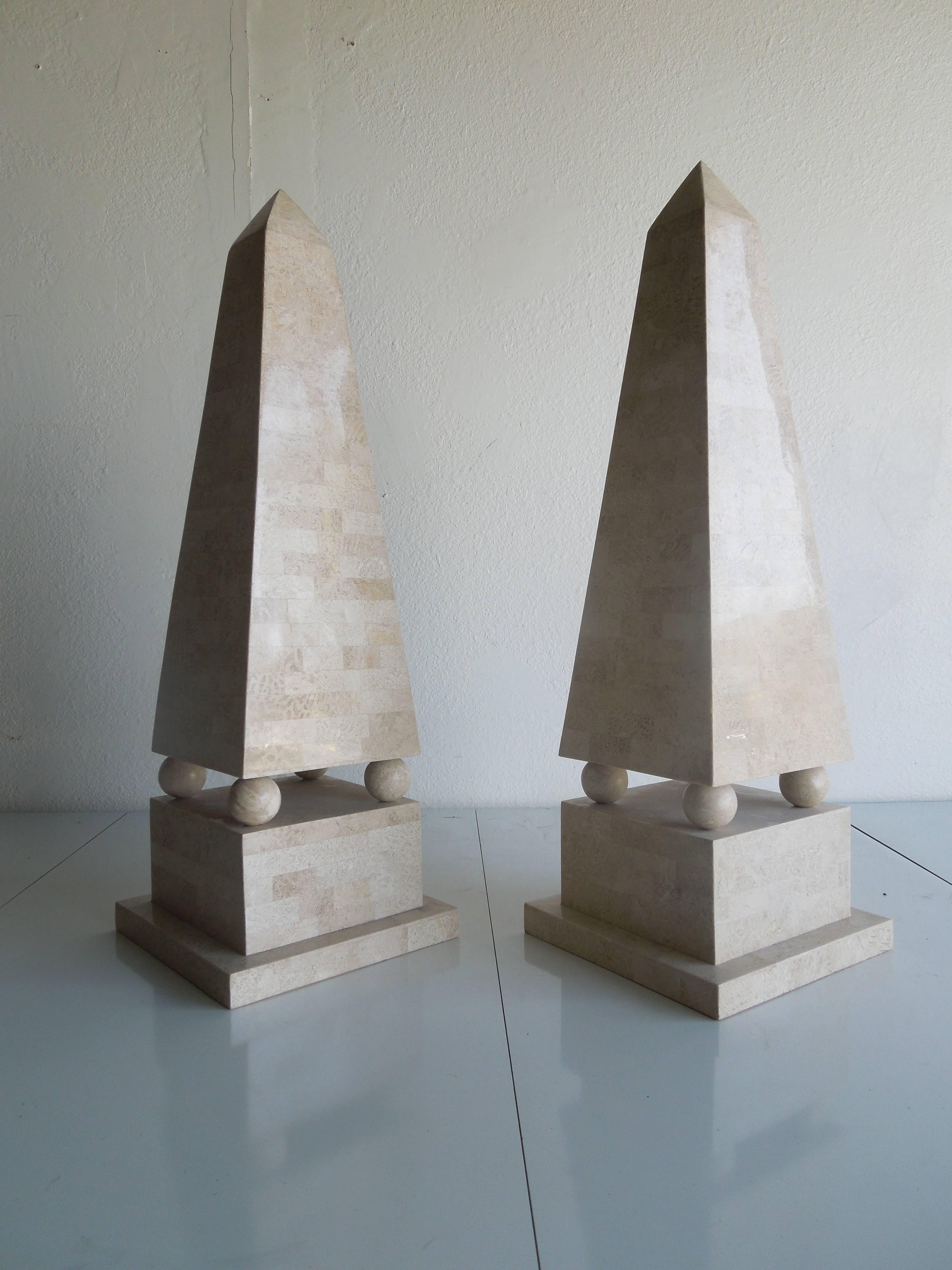 From a very upscale Palm Springs estate, a rare pair of large tessellated stone obelisks done in the 