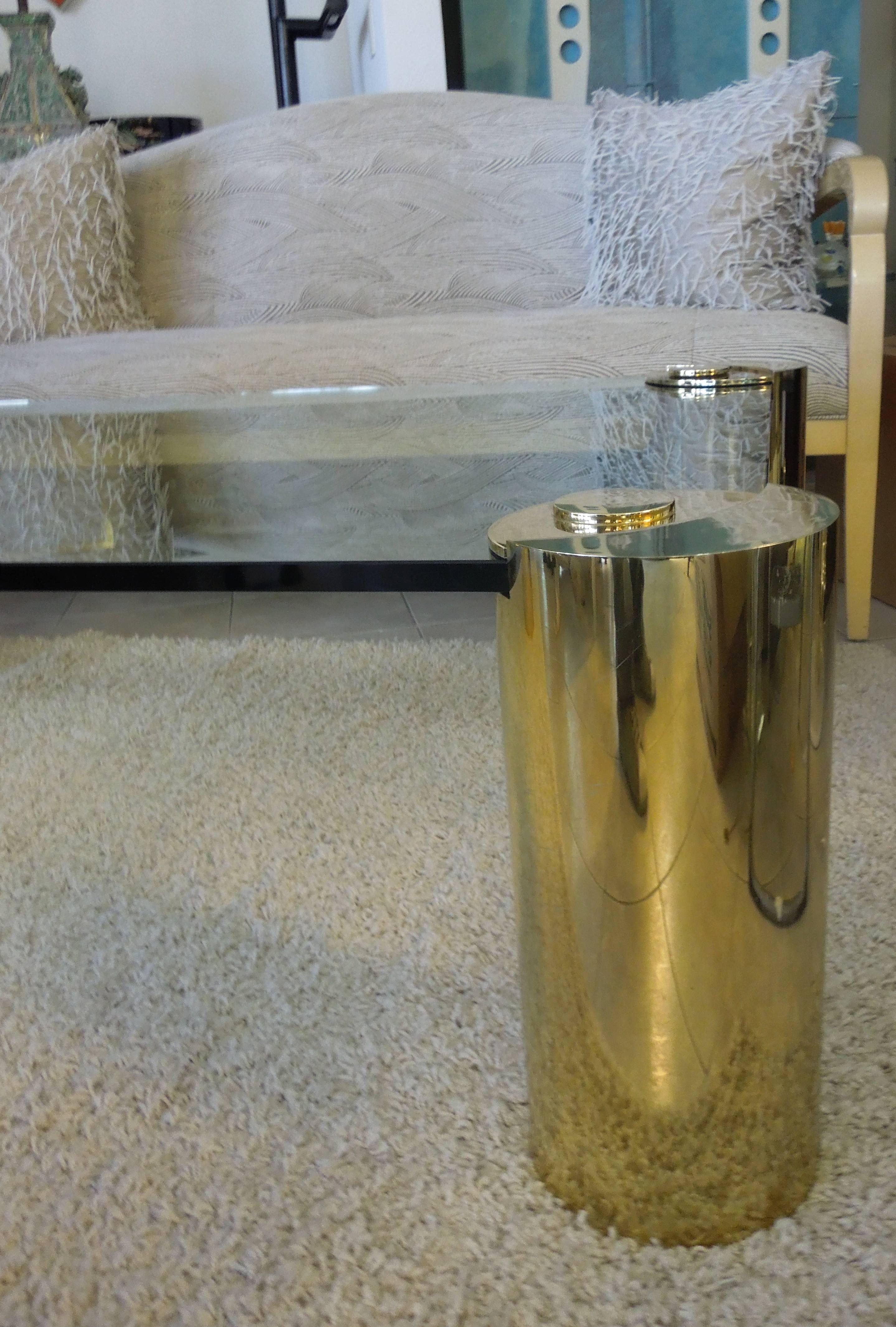 A gorgeous chic, modern piece of furniture believed to be designed by Karl Springer. Unsigned. From a VERY upscale, professionally designed  Rancho Mirage Estate. This 3/4" glass and brass coffee table centered the vintage living room and  was