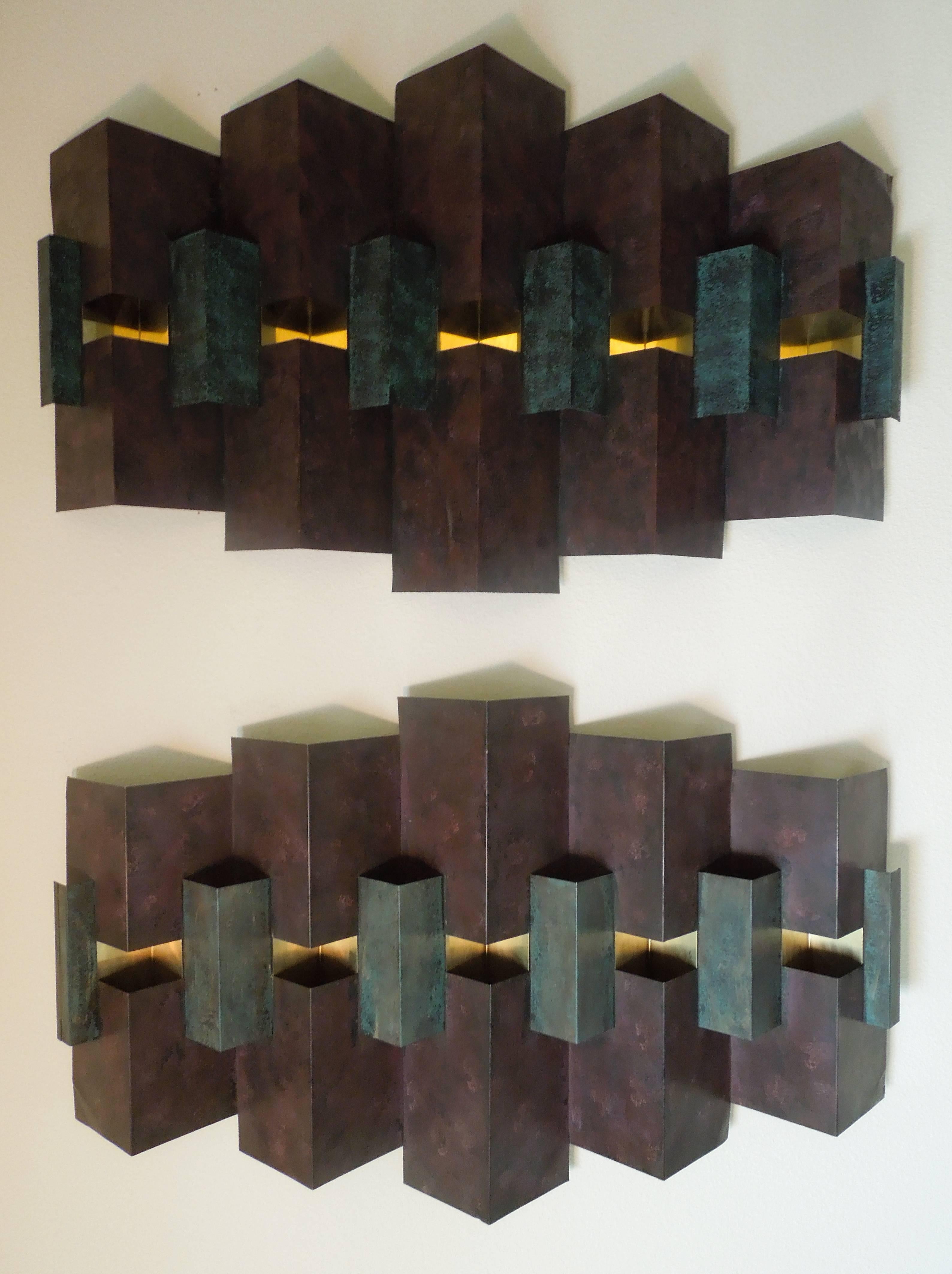 From a very upscale and interesting Palm Springs setae are a pair of 1993 signed, Jere wall sculptures. They were hung vertically but are meant to be hung horizontally as well if desired. Each one hand painted, they are slightly different colors