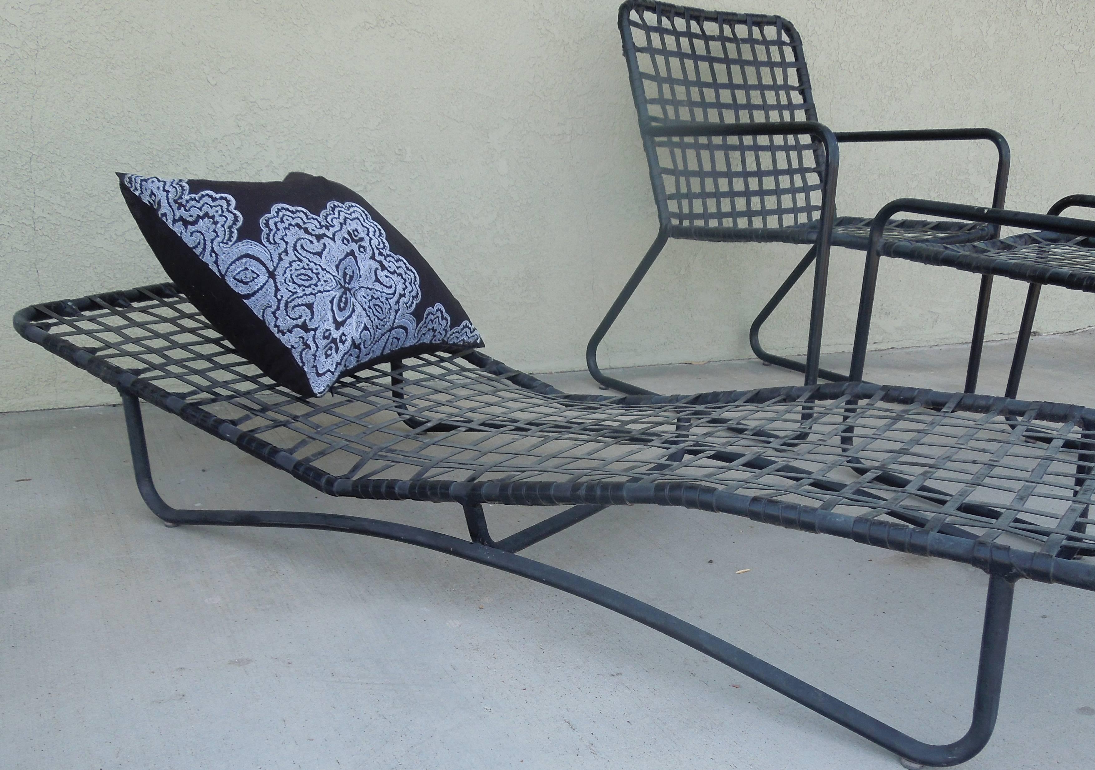 From a very upscale Palm Springs Estate, a rare 1960s ordered four-piece black on black set from Brown Jordan. The two chairs and single matching ottoman are from the LIDO collection. The chaise lounge is a rare Sun Lounger. The pieces have been