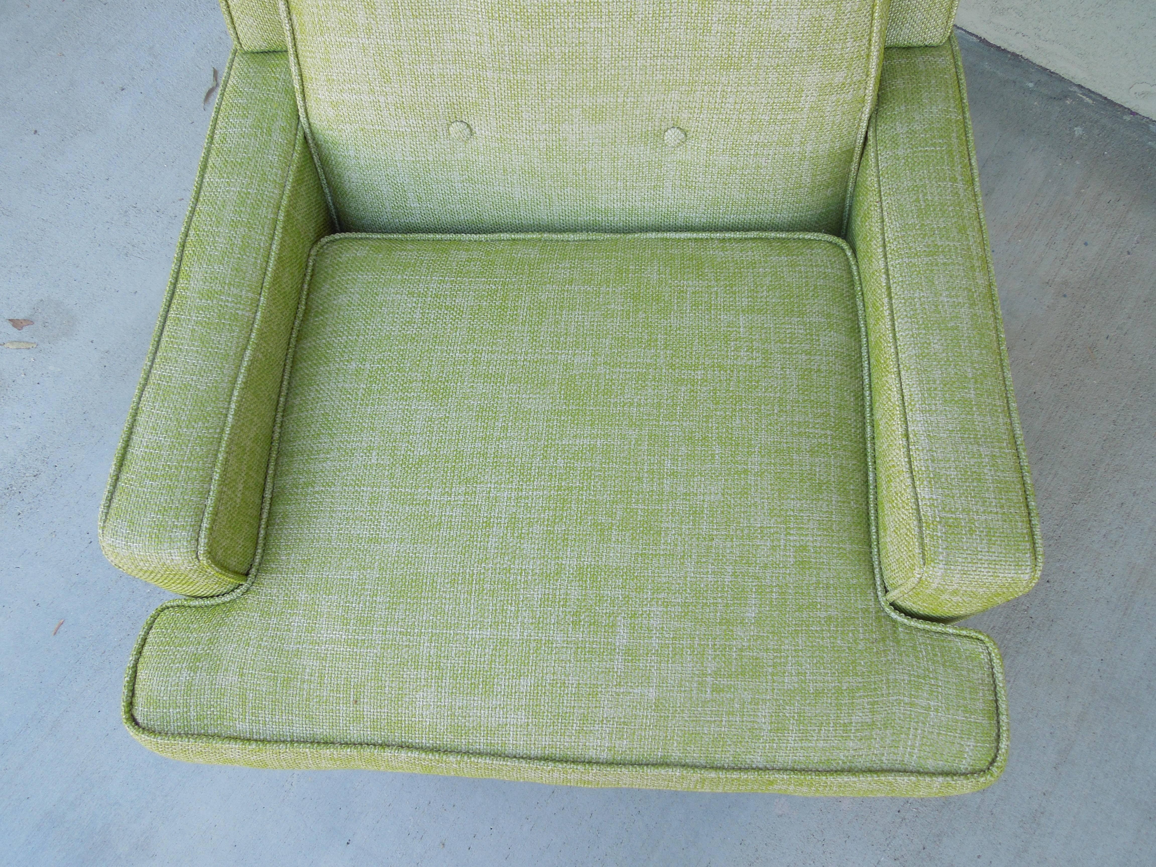 This chair in the wormley/Dunbar style has been newly upholstered in very high end lime tweed from Baker. Expertly reupholstered with self buttons and tailored piping. This is one of the best shape 1960s armchairs I have ever seen. Original walnut