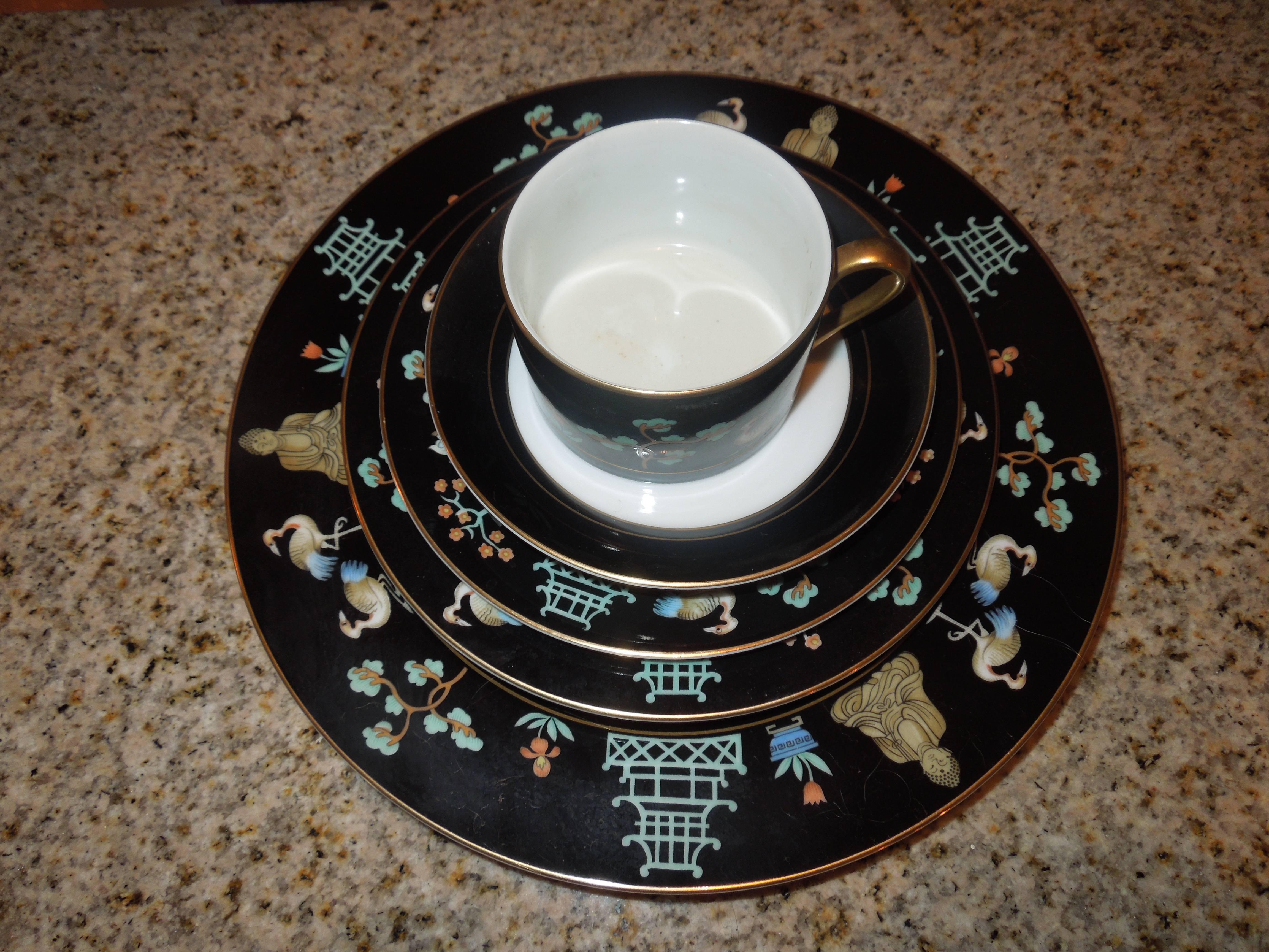 This set of rare 1978 chinoiserie china by the legendary team of Fitz and Floyd came from a very upscale Palm Springs estate that had over ten different sets of designer China and appears to have never been used. Chinoiserie (Pagoda, Buddha, birds,