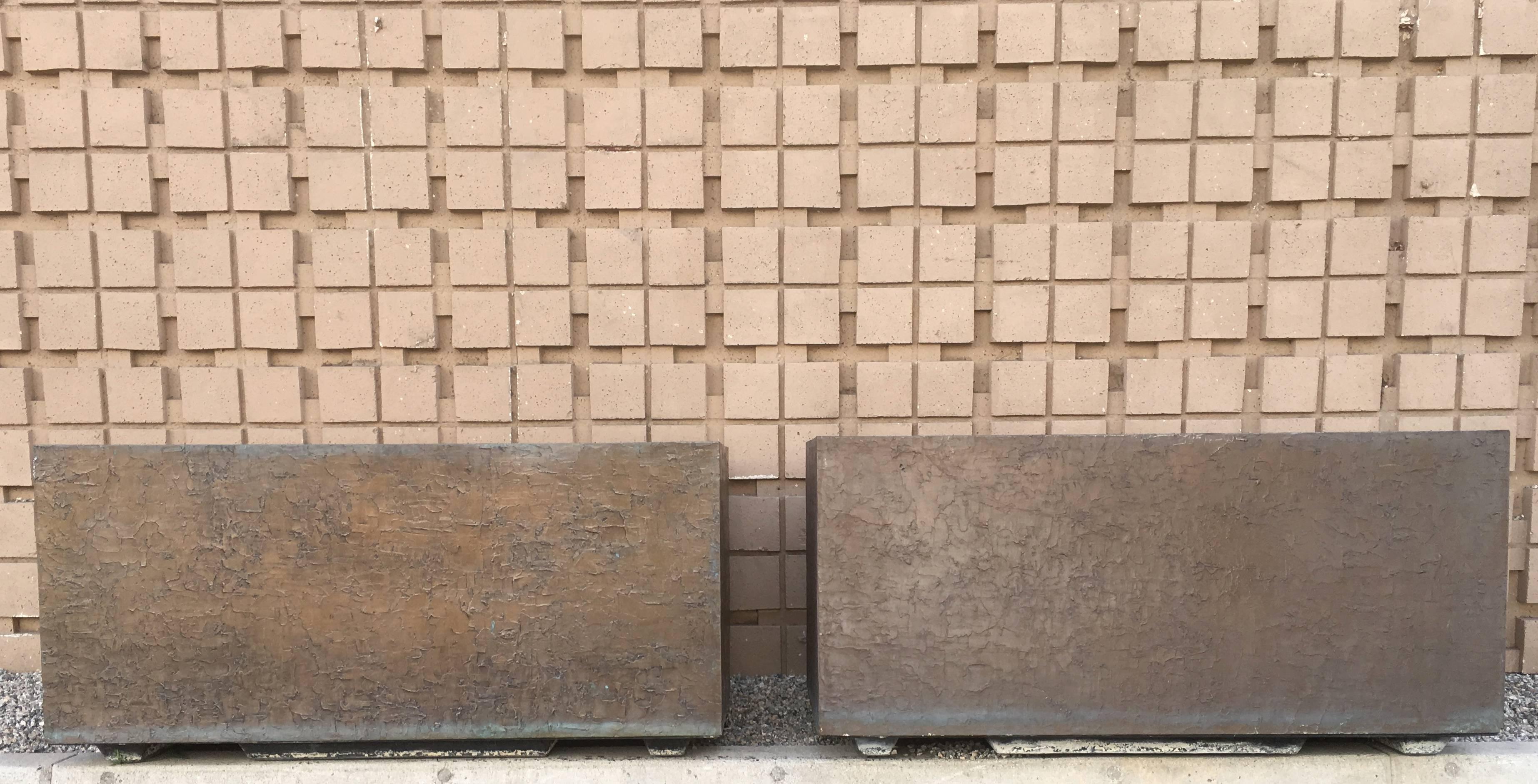 From an "A-list celebrity" estate in palm springs, are a pair of large, rectangular planters made by the legendary company Forms and Surfaces, 1970s. They are made of sturdy fiberglass inside with a beautiful Brutalist pattern bonded