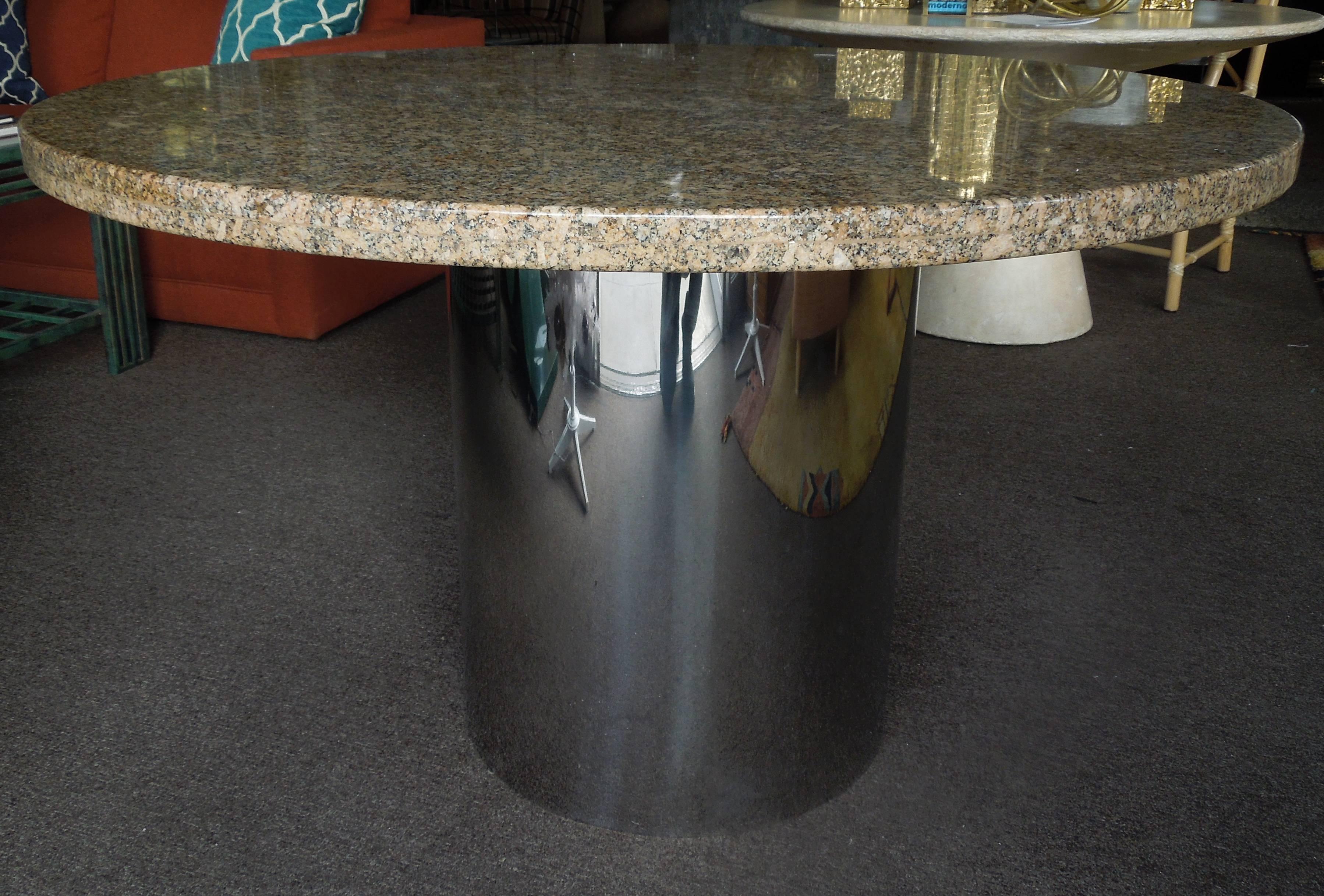 From a dynamic 1980s Rancho Mirage Estate in Rancho Mirage, CA entirely designed by the late Steve Chase, is his iconic chrome drum and fossilized granite game or dining table. The top has a clean thic edge and well made with solid wood construction