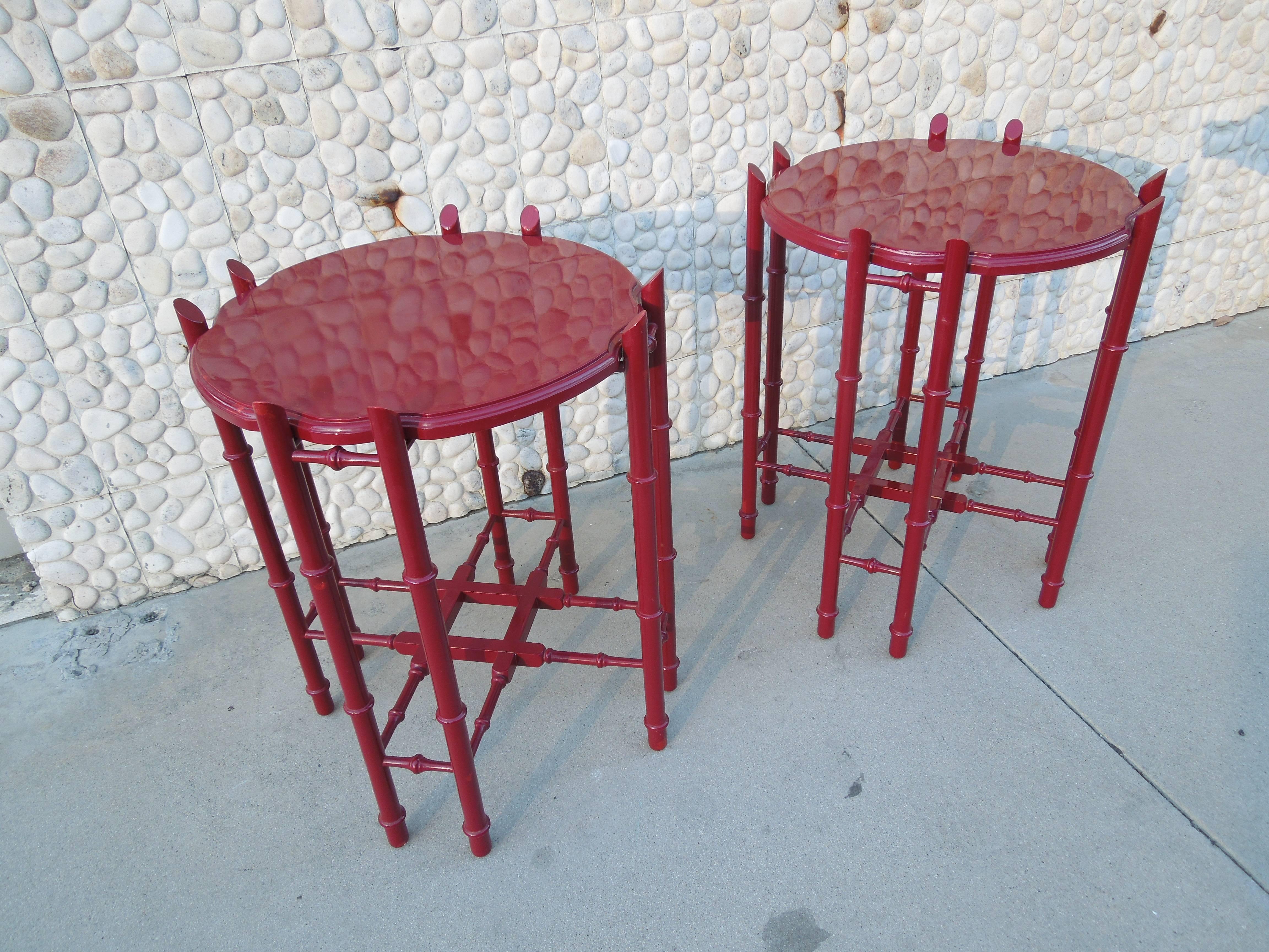 From a very chic, upscale vintage estate in Palm Springs are a pair of cinnabar color lacquered tray table in chic chinoiserie styling with faux bamboo legs. Tops lift off to double as a tray.