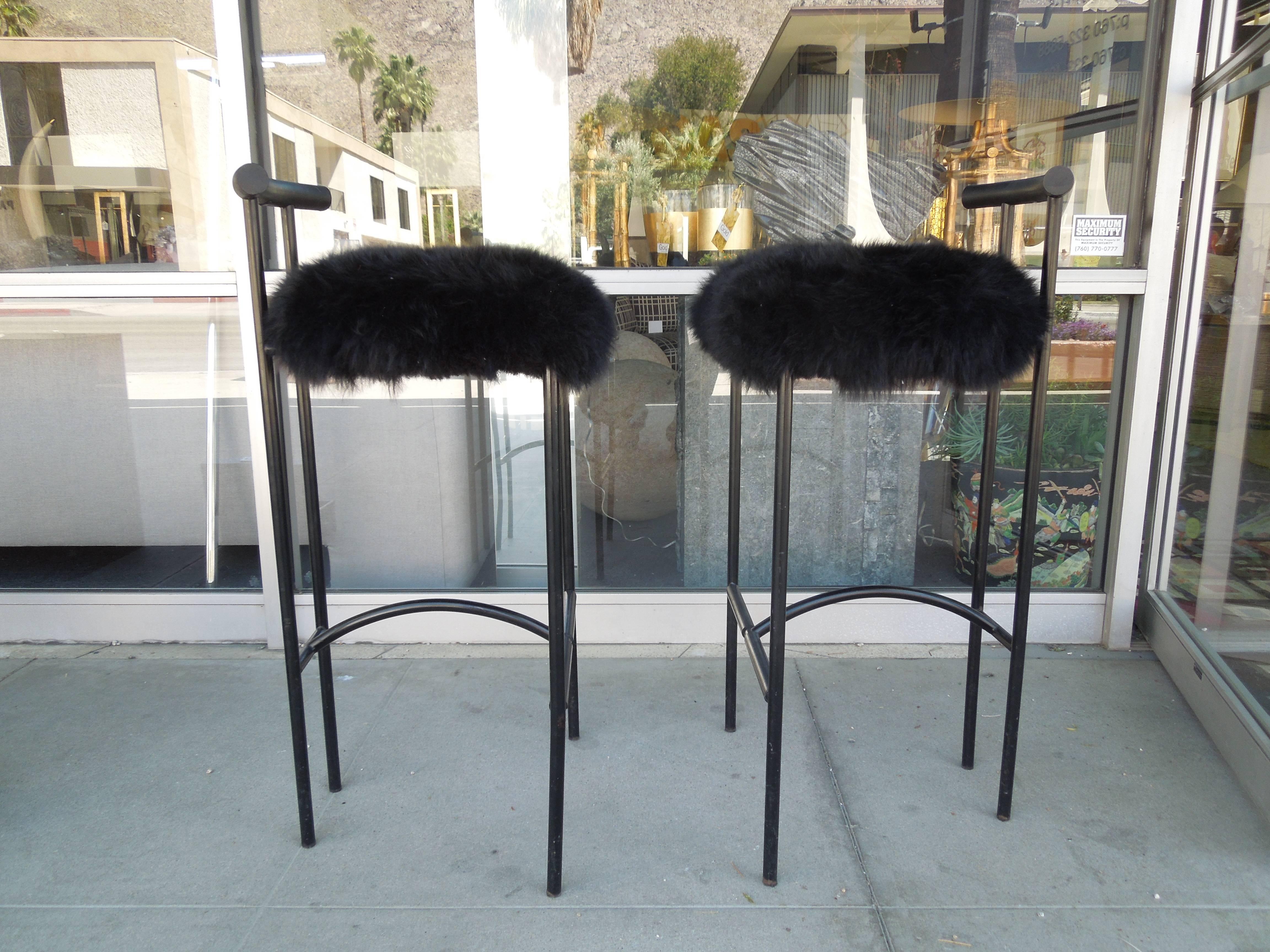 A super chic pair of Tokyo barstools designed by talented UK designer Rodney Kinsman. They are made in Padova, Italy for Bieffeplast. The seat has been covered in black thick sheepskin. Uber modern and chic.
