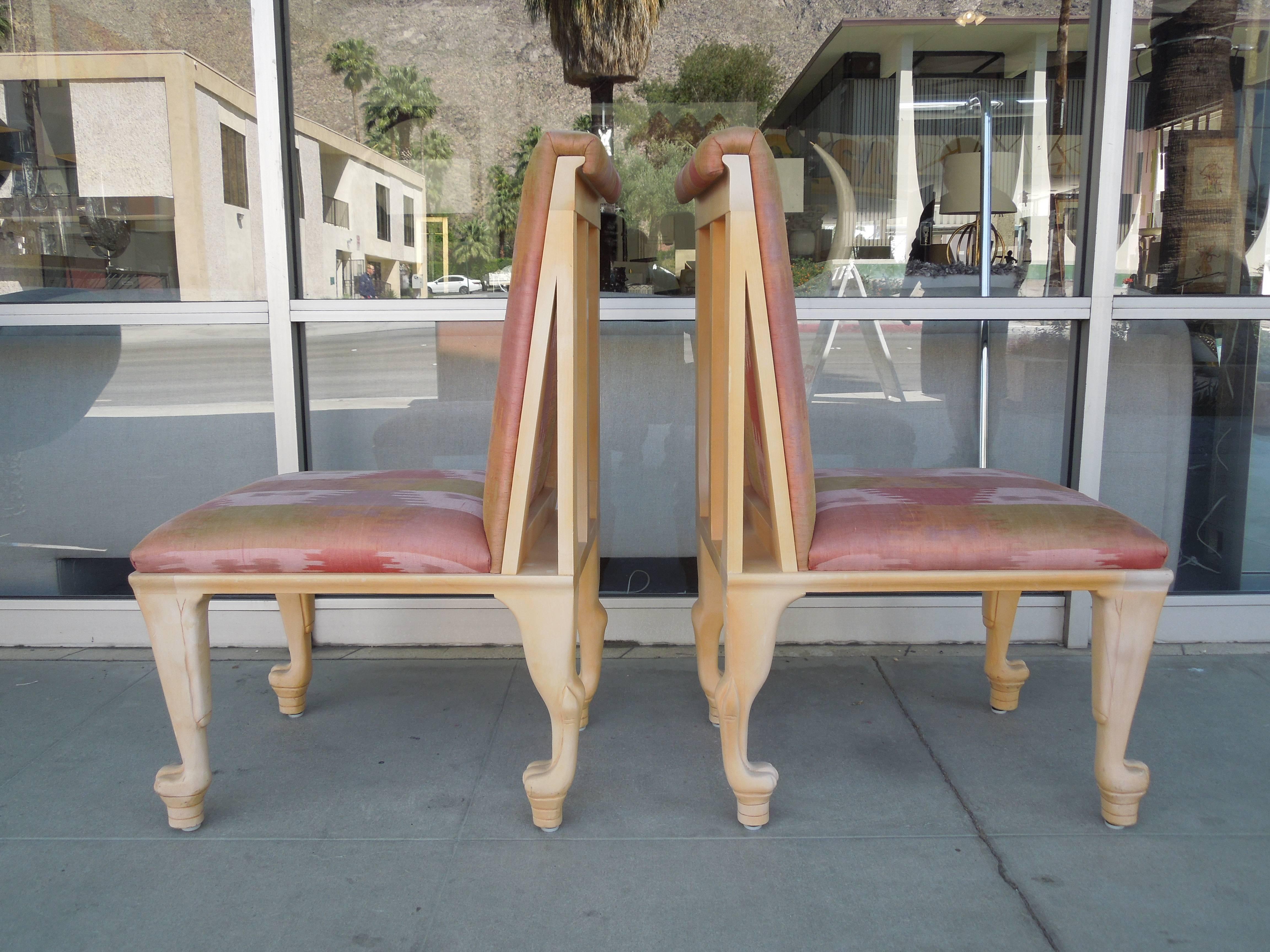 This Rare pair of chairs came from a very upscale estate and are spectacular in their unusual shape and detail. Designed by the legendary San Francisco designer John Hutton for Randolph & Hein. Bleached wood (original shades of light/dark in the