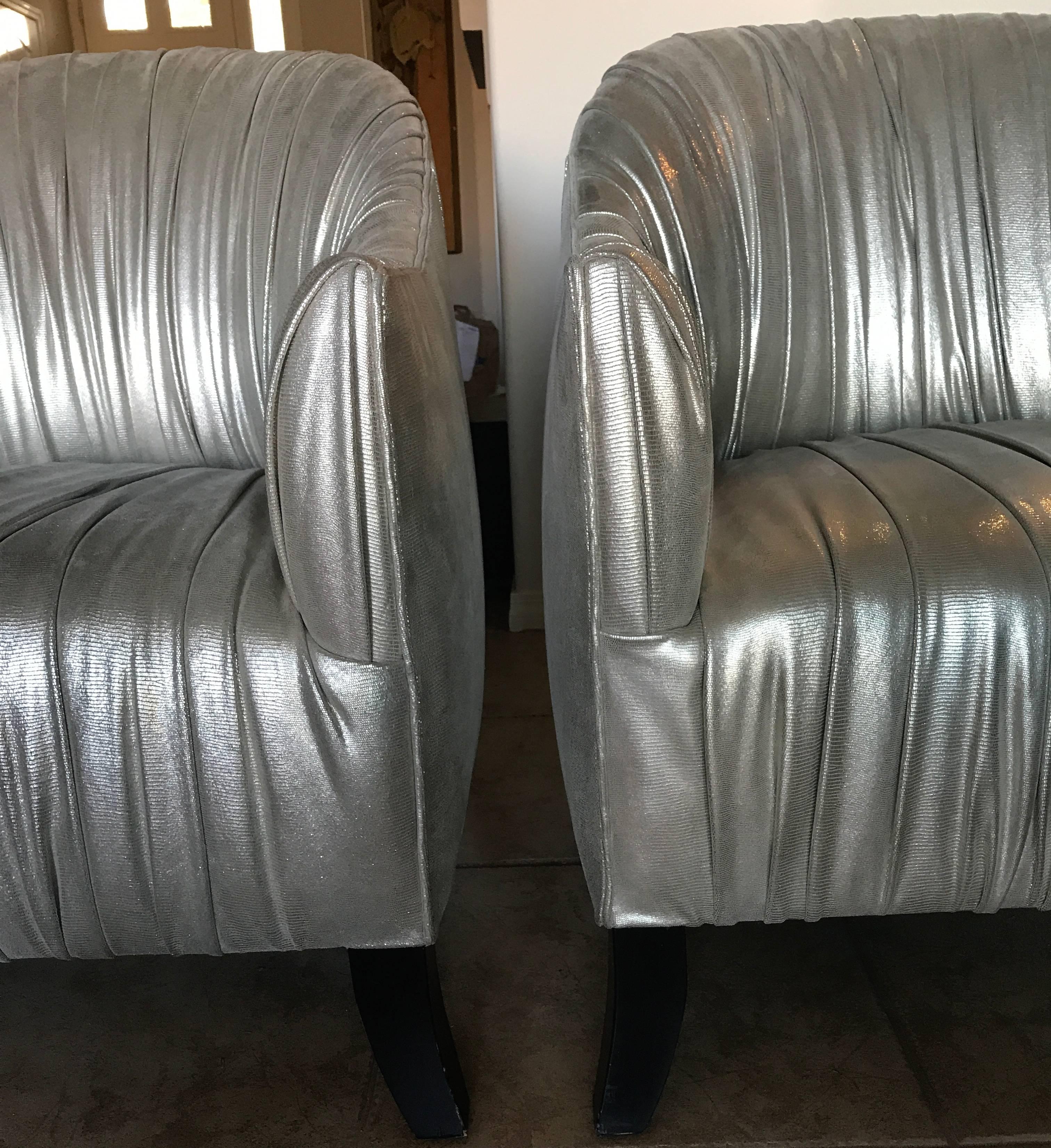 These amazingly chic, stylish chairs were custom-made in Los Angeles for a celebrity client and never used. They were hand made in the most expensive metallic silver leather hides costing thousands in skins alone. The entire fronts are ruched a la