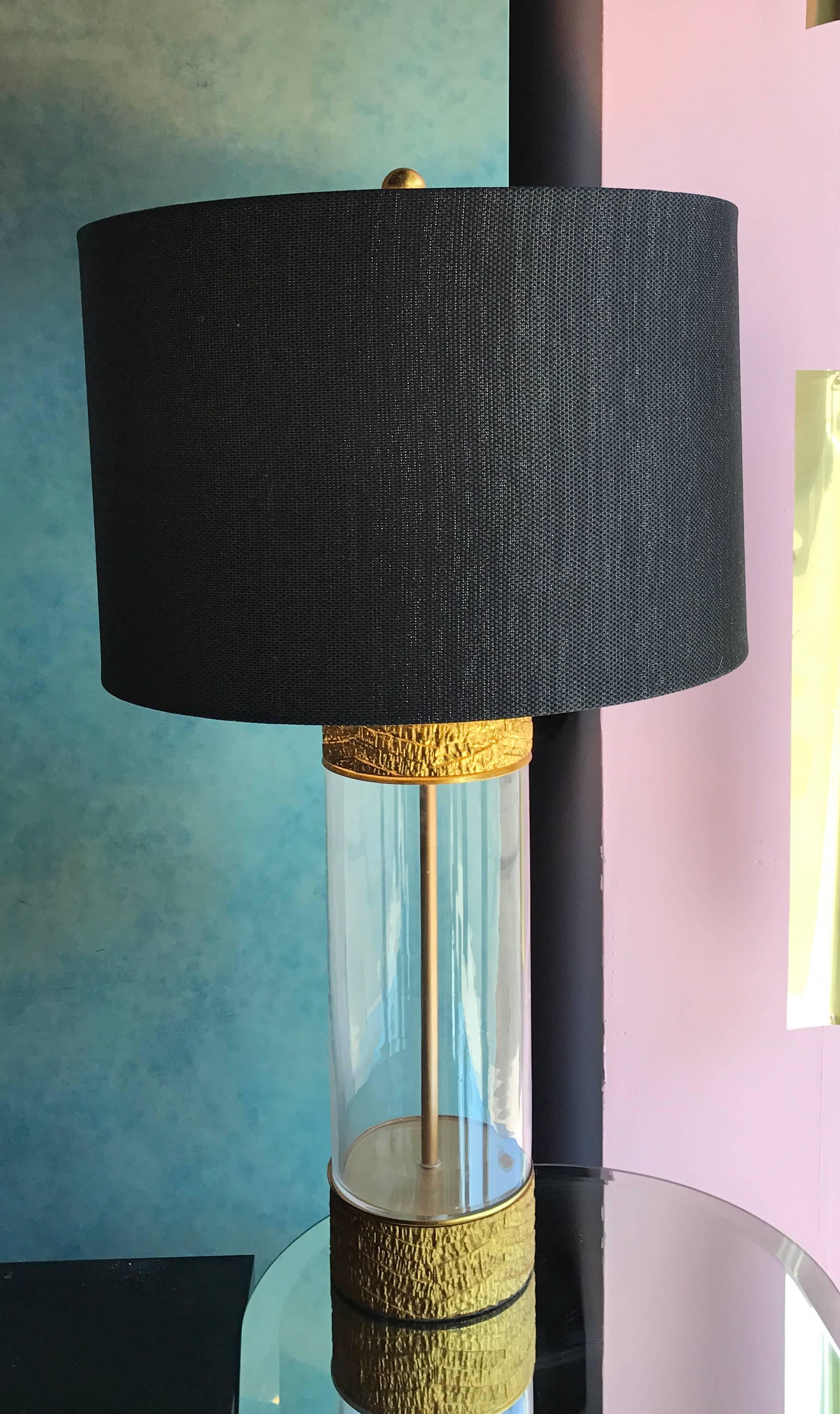 These lamps are amazing and striking. They came from the home of a prominent Palm Springs interior designer. Maker and country of origin is unknown. The shades were custom-made for the lamp and are black and metallic silver barrel shades. The clear