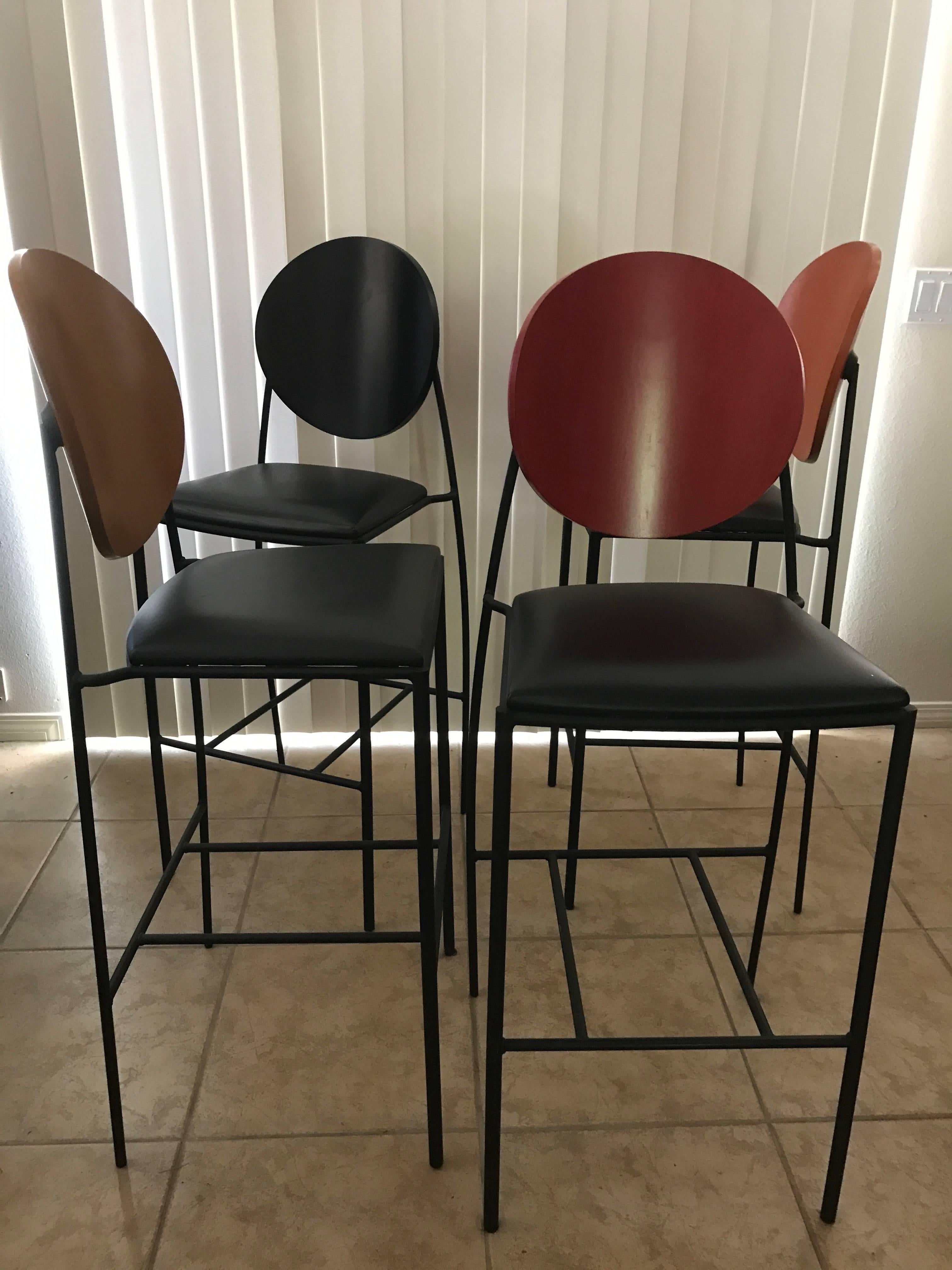This amazing set of four barstools came from a multi million dollar Palm Springs estate. This Vik-Tor 2 design has been discontinued from the Dakota Jackson line and are no longer available. This unique set of four stools were special ordered in the
