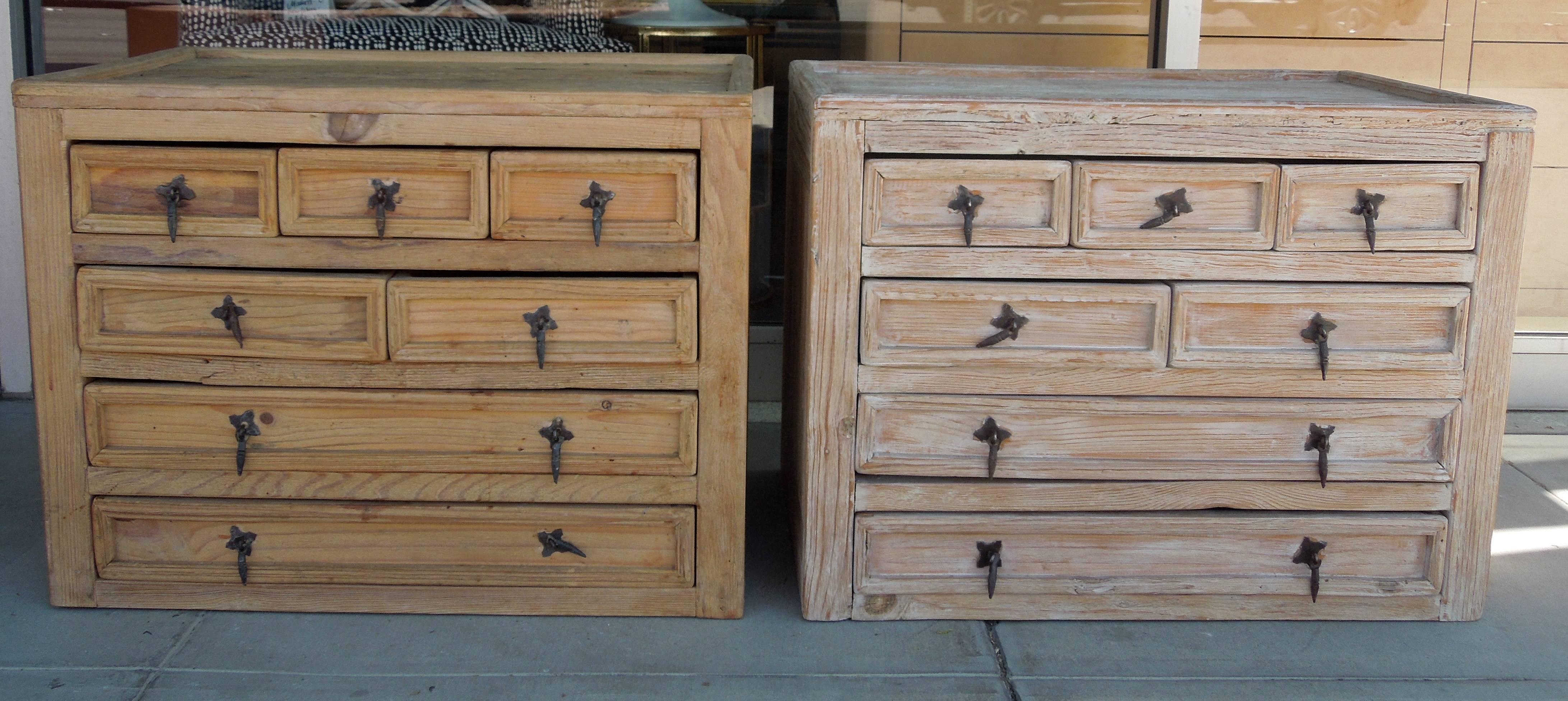 This pair of custom-made seven-drawer cabinets came from a very high end Palm Springs residence. I have had a similar pair before that came with paperwork and they were made in the 1960s in Mexico. The awesome Brutalist hanging pulls are blackened