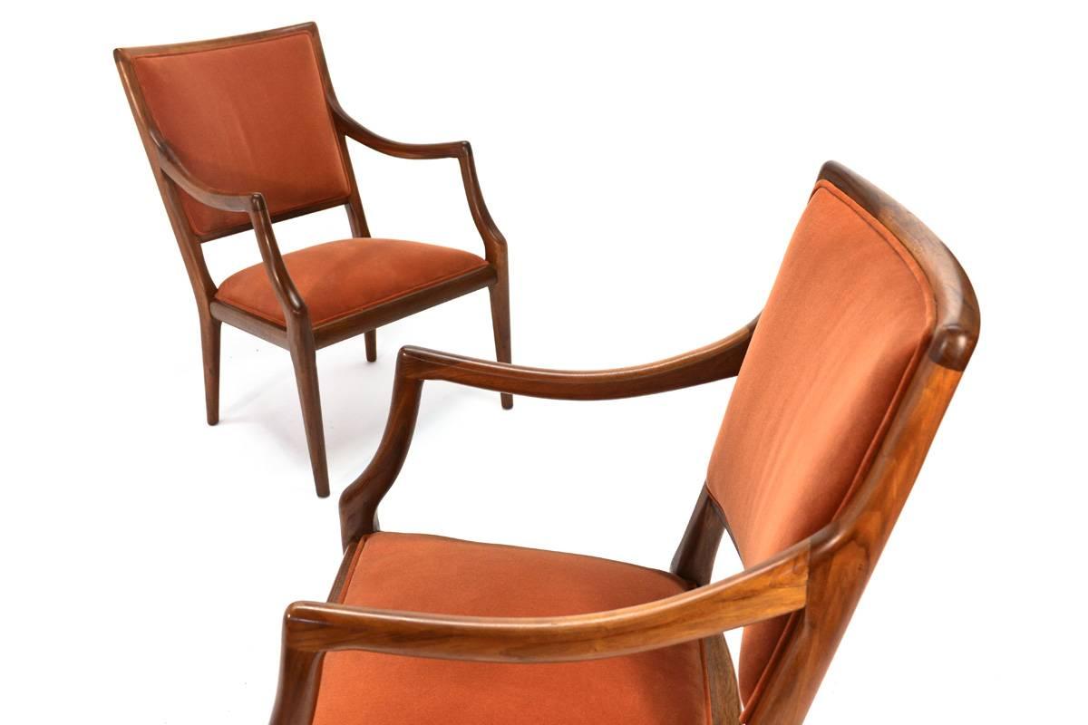 Beautiful pair of sculptural walnut lounge chairs, these were a part of the Grand Haven line produced by Jamestown Lounge Company. These feature a nice orange crushed velvet upholstery. They are very nicely scaled, providing a comfortable lounge