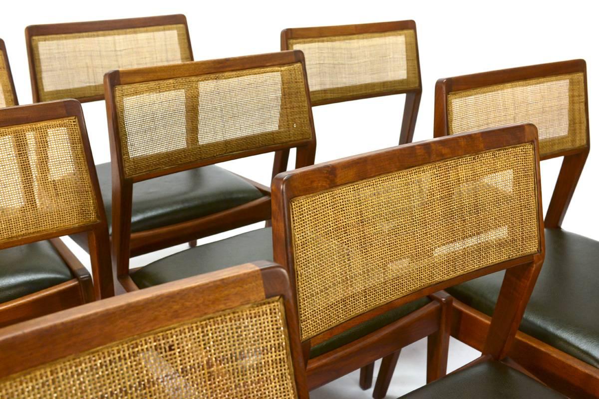 Set of eight walnut dining chairs designed by Jens Risom. These are officially known as the C140, but they are more frequently referred to as the playboy chair because Jens chose to appear with this chair in a 1961 article in Playboy magazine