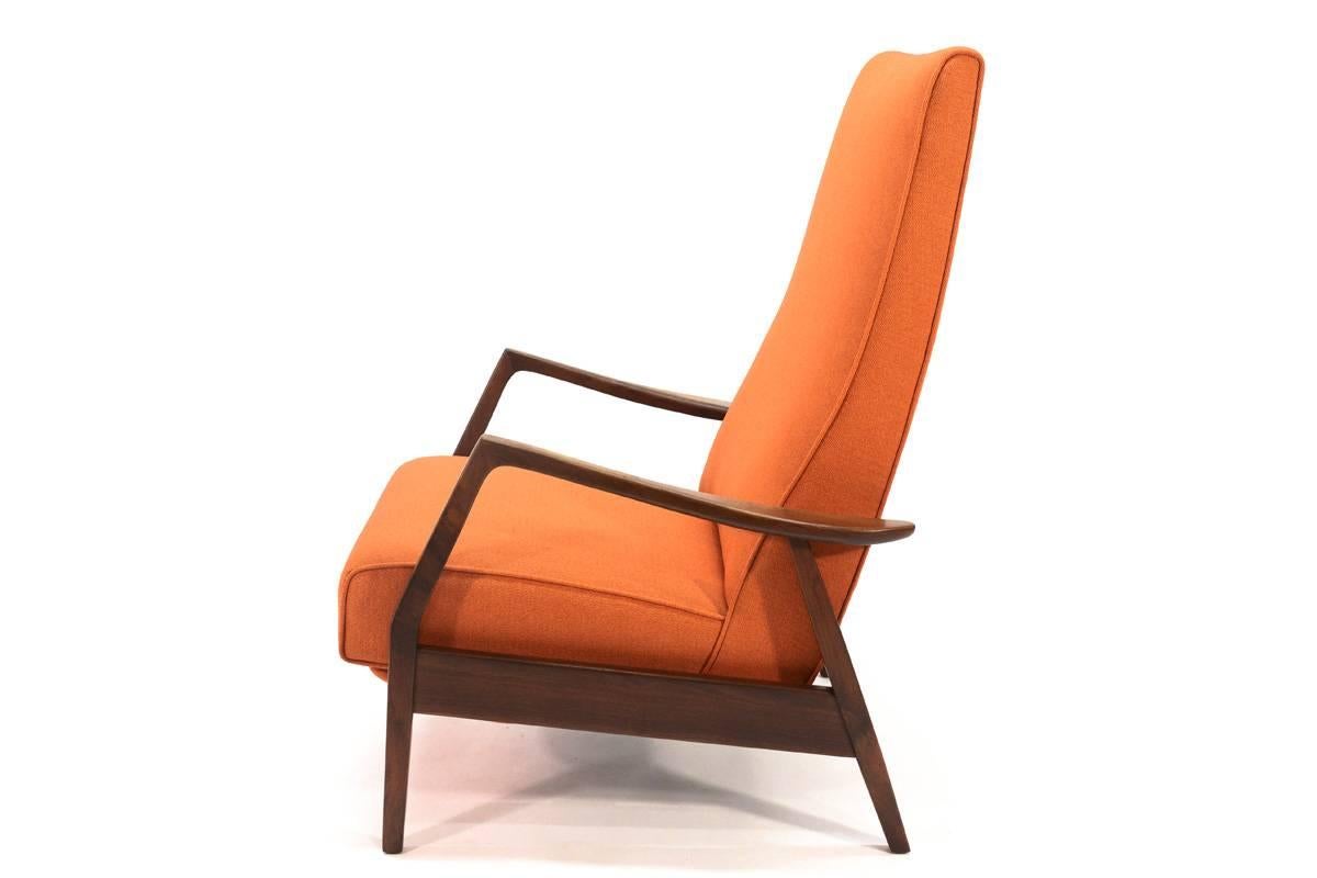 A Mid-Century Classic. High back walnut frame recliner designed by Milo Baughman for Thayer Coggin. This example dating from the 1960s. This chair offers three positions, upright, partially reclined, and fully reclined. It is extremely comfortable.