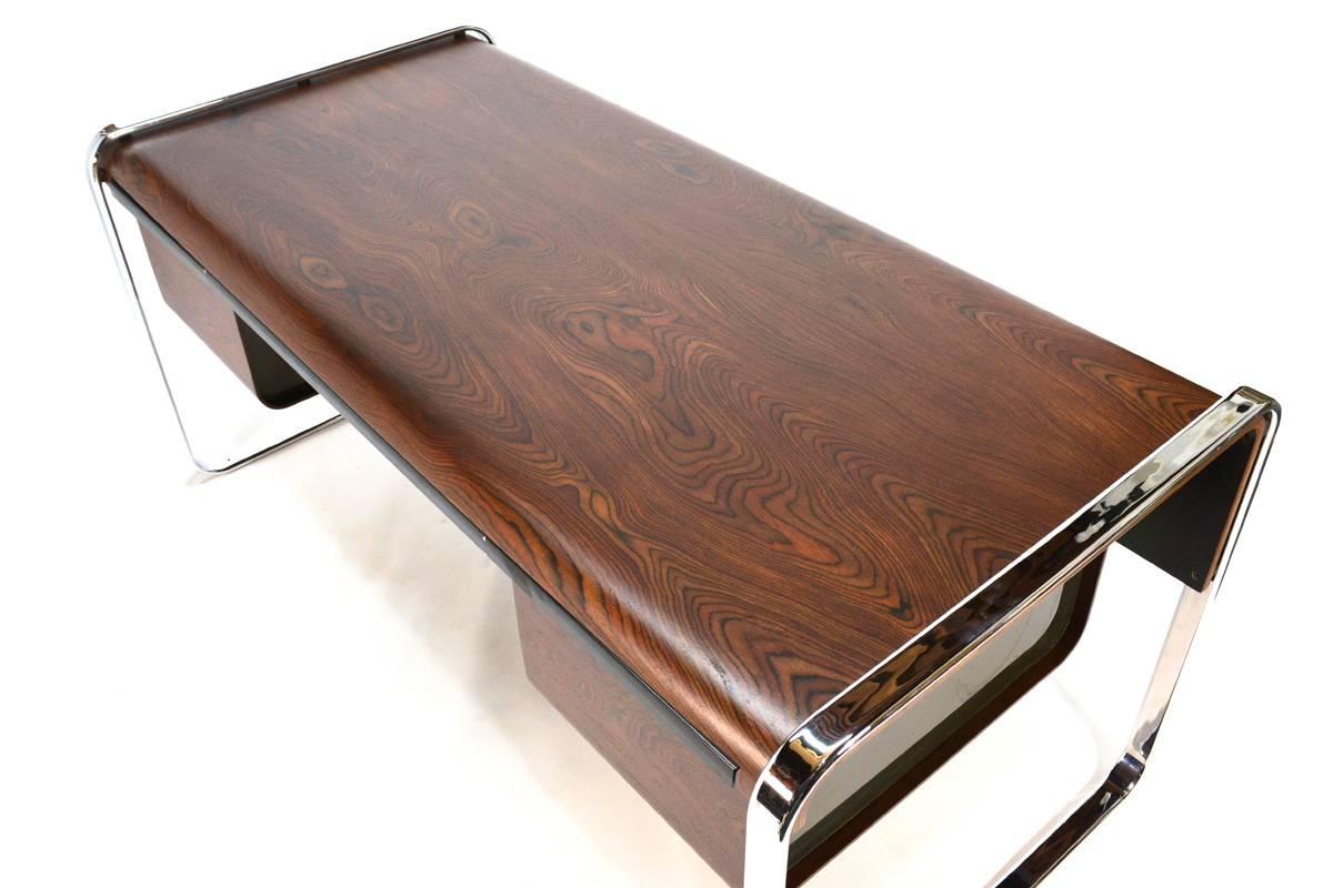 Beautiful zebrawood and chrome desk designed by Peter Protzman for Herman Miller that was only produced for a short period of time because of issues with complexity and cost while trying to mass produce this design. The two file drawers feature