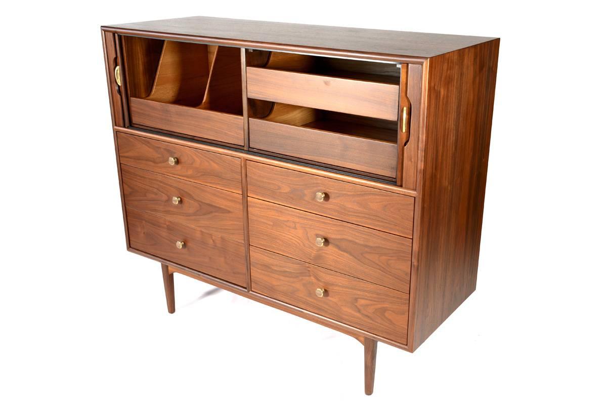 Beautiful high boy double dresser from the Drexel Declaration line designed by Kipp Stewart and Stewart MacDougall. The lower portion is a traditional six drawer double dresser, and then the upper portion has beautiful tambour doors that roll back