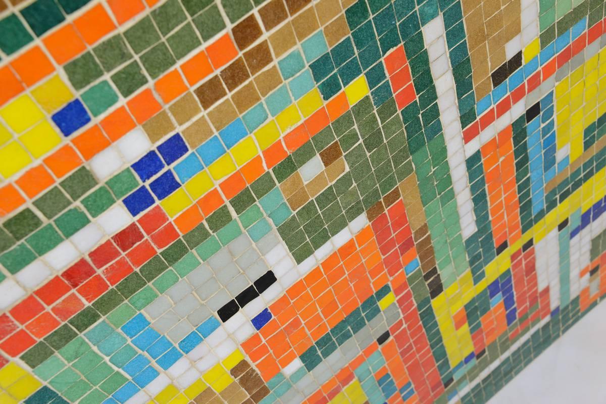 Very fun piece handmade in 1955 by a couple in Salt Lake City. Italian glass tiles with a solid brass frame. It appears that they used it as a table, but it was later converted into a hanging art piece. It could be used either way. Features really