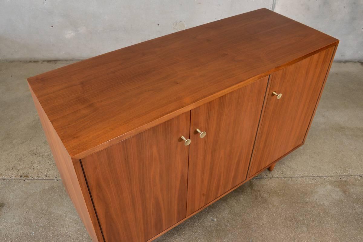 This walnut credenza designed by Milo Baughman for Glenn of California in the 1950s is a very cool piece. It is probably the best original condition Baughman for Glenn piece we have seen. Its hard to believe this piece is 60+ years old. It is also