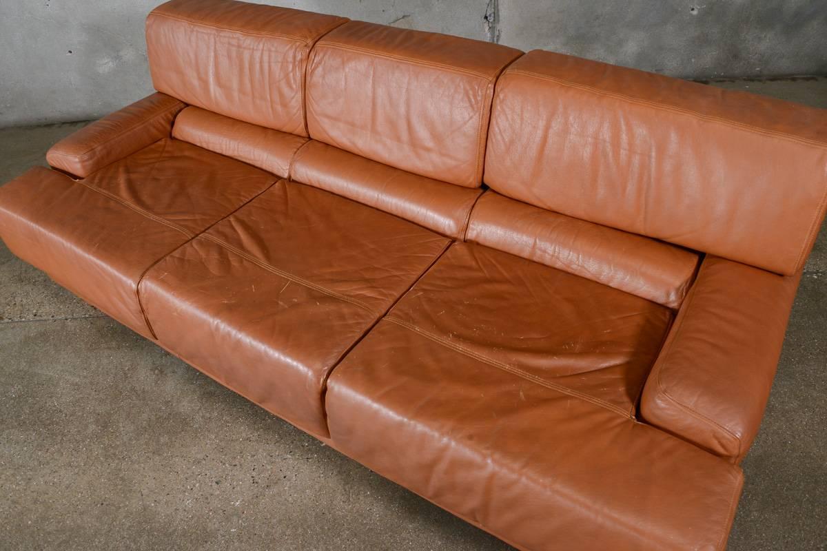 Fantastic vintage leather sofa designed by Percival Lafer in the 1970s. This piece is extremely comfortable. The backrests can tilt up and back providing a higher and more reclined back. This piece is in original condition with normal wear from age