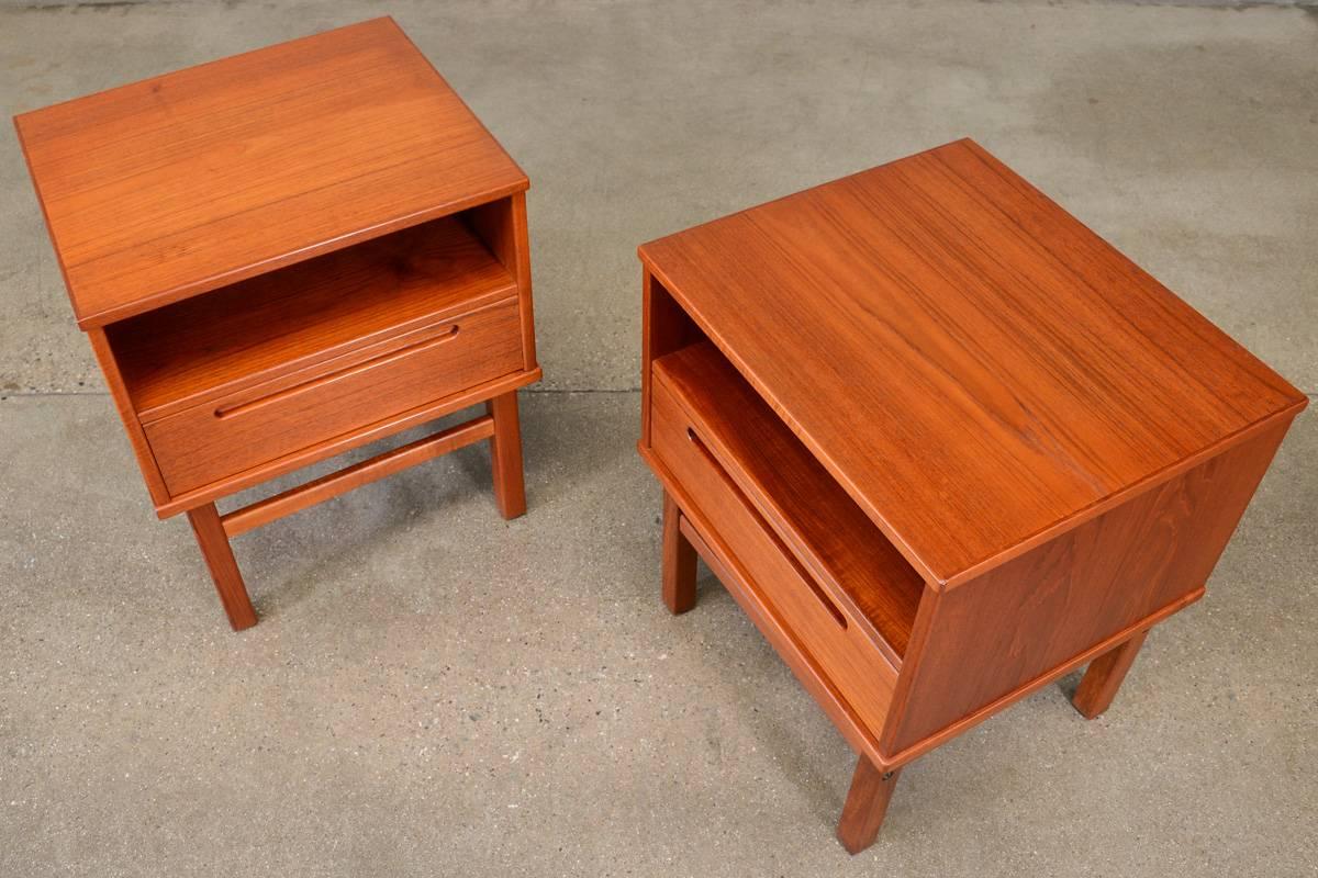 Pair of nightstands designed by Nils Jonsson for HJN Mobler of Denmark in the 1960s. A great simple design in richly toned teak. These are in very good original condition with very light normal wear from use. One nightstand shows some light