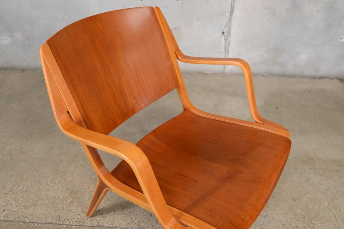 A Classic 'AX' chair designed by Peter Hvidt & Orla Mølgaard-Nielsen for Fritz Hansen in 1950. This chair features a birch ply frame with inset mahogany in the legs and a bent teak back and seat. This piece has been fully restored and is in