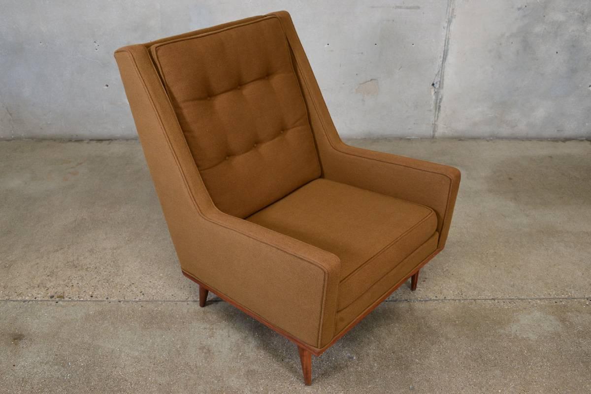 Fantastic high back lounge chair designed by Milo Baughman for James Inc as part of the articulate seating collection in the 1950s. This chair is defined by its Classic Mid-Century lines and simple walnut framed base. This example is in beautiful