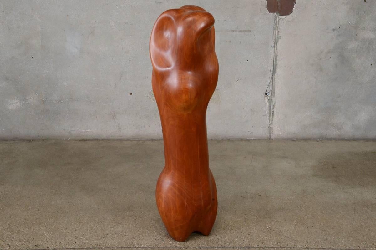 One of three carved wood sculptures we currently have by Hungarian artist Istvan Toth who lived and worked in Hollywood in the 1960s through the 1990s. Dating to the 1970s this piece has a very organic form, it carved from a single log, and is quite