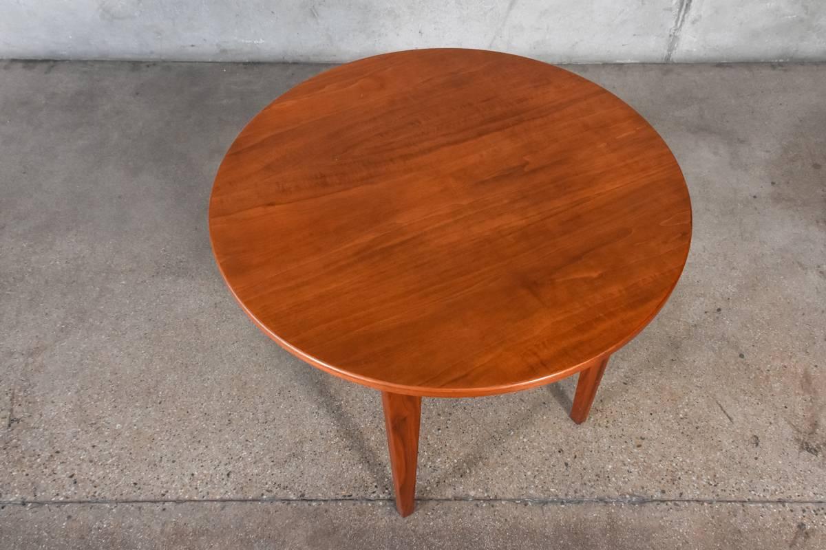 Walnut side table designed by Jens Risom. Beautiful and simple piece, utilizing some fantastic walnut as most of his pieces did. This piece is in very nice original condition with some very minor discoloration to the top.

Measures: 26