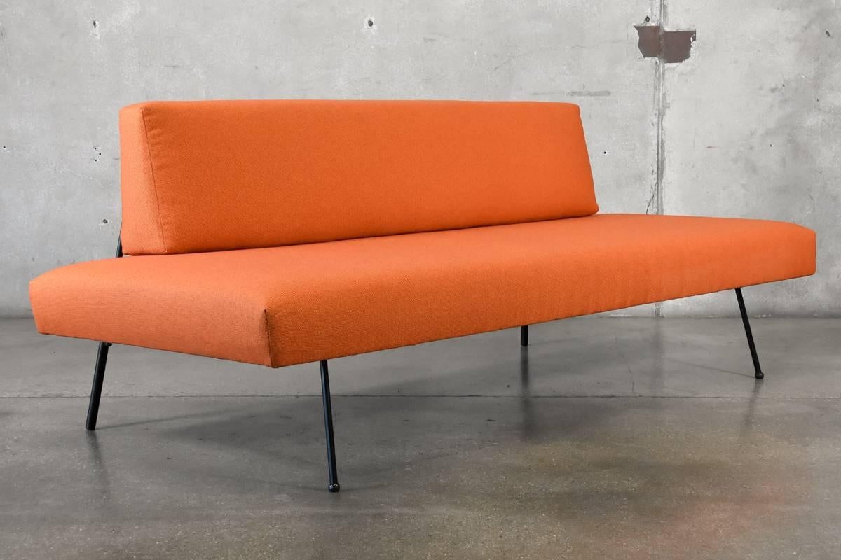 An uncommon early iron daybed designed by Adrian Pearsall for Craft Associates. This is the model 102-R. It has been reupholstered in orange Knoll fabric. Seat height is 16