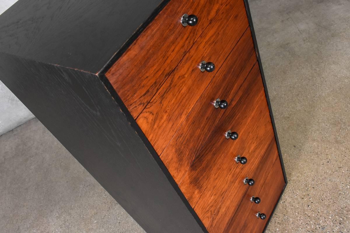 A unique lingerie chest in rosewood and ebonized oak by Harvey Probber. The eight rosewood drawers really pop against the ebonized case. This piece is in original condition, there are some light scuffs and scratches.

Measures: 14