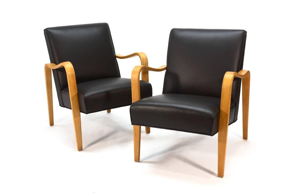 These classic chairs were produced by Thonet in the manner of Aalto. Thonet was actually sued over the production of these chairs and had to stop making them. These are super comfortable and have new dark brown leather upholstery. Beautiful elegant