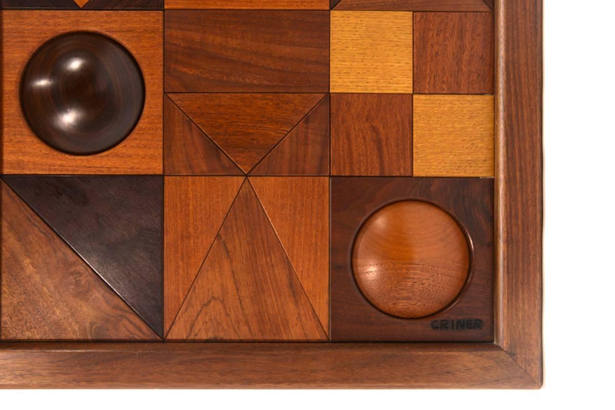 Beautiful hand made art piece by Dave Criner. Various woods all come together to create this fantastic geometric panel. A description really doesnt do this piece justice, and neither do the photos, you have to see it in person.

17.5″ x 47.5″ x 2″