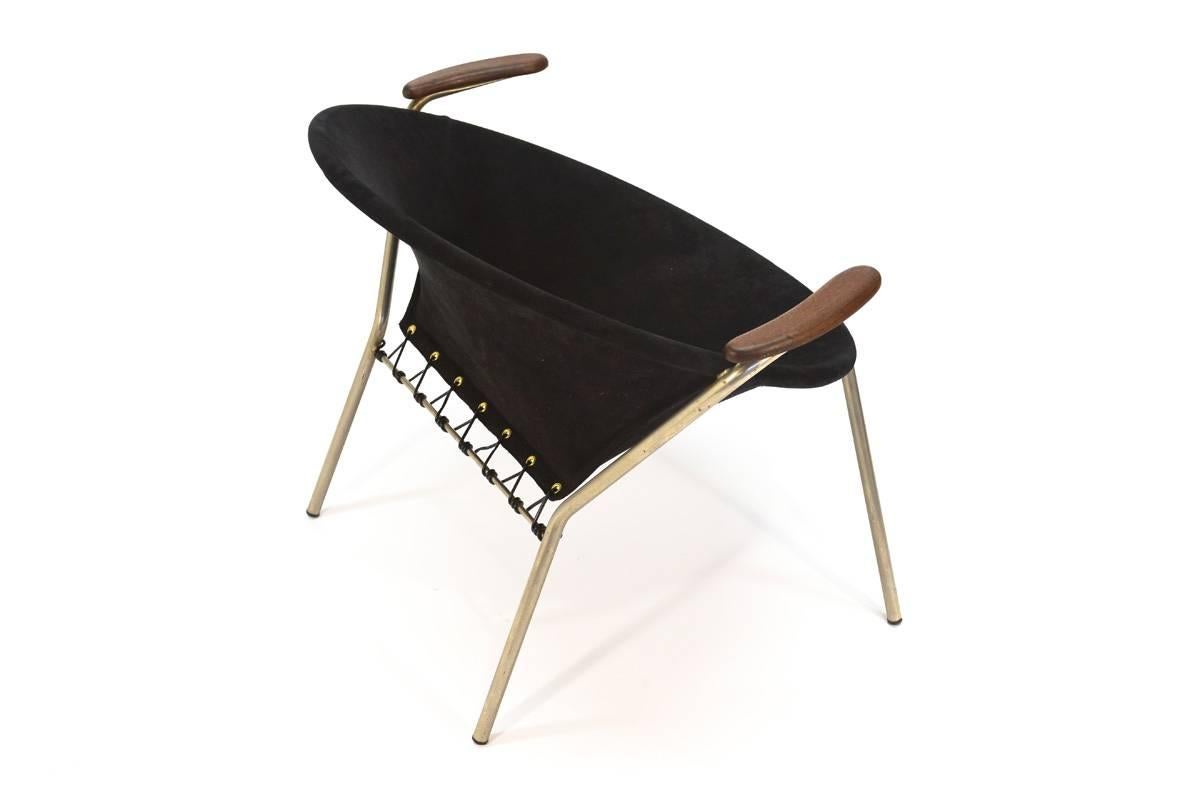 A very uncommon chair designed by Hans Olsen for LEA of Denmark in 1955. Very fun simple design. Features a lacquered metal frame with teak armrests and a suede seat. The frame and arms are all original, unfortunately the original seat was far