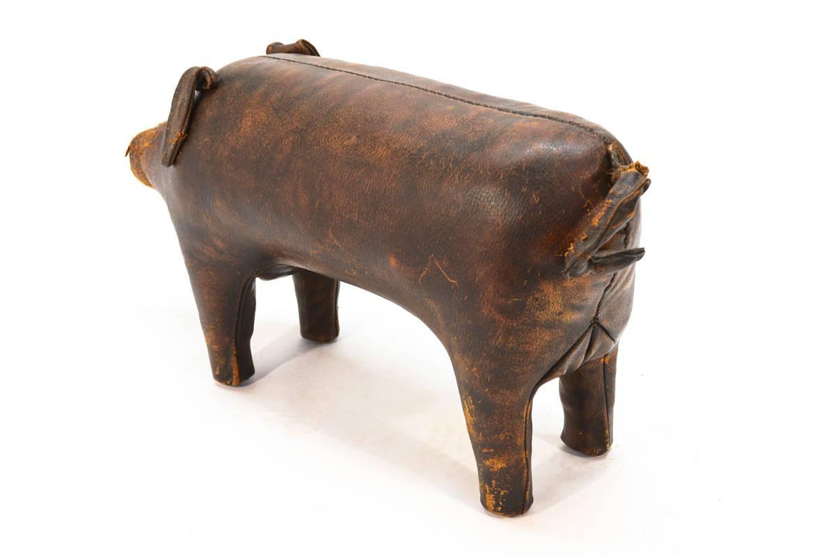 A very fun piece designed by Dimitri Omersa for Abercrombie and Fitch in the 1960s. Part of a line of leather animals that were meant to be used as ottomans and stools. This example shows notable wear to the snout as pictured and the tail is