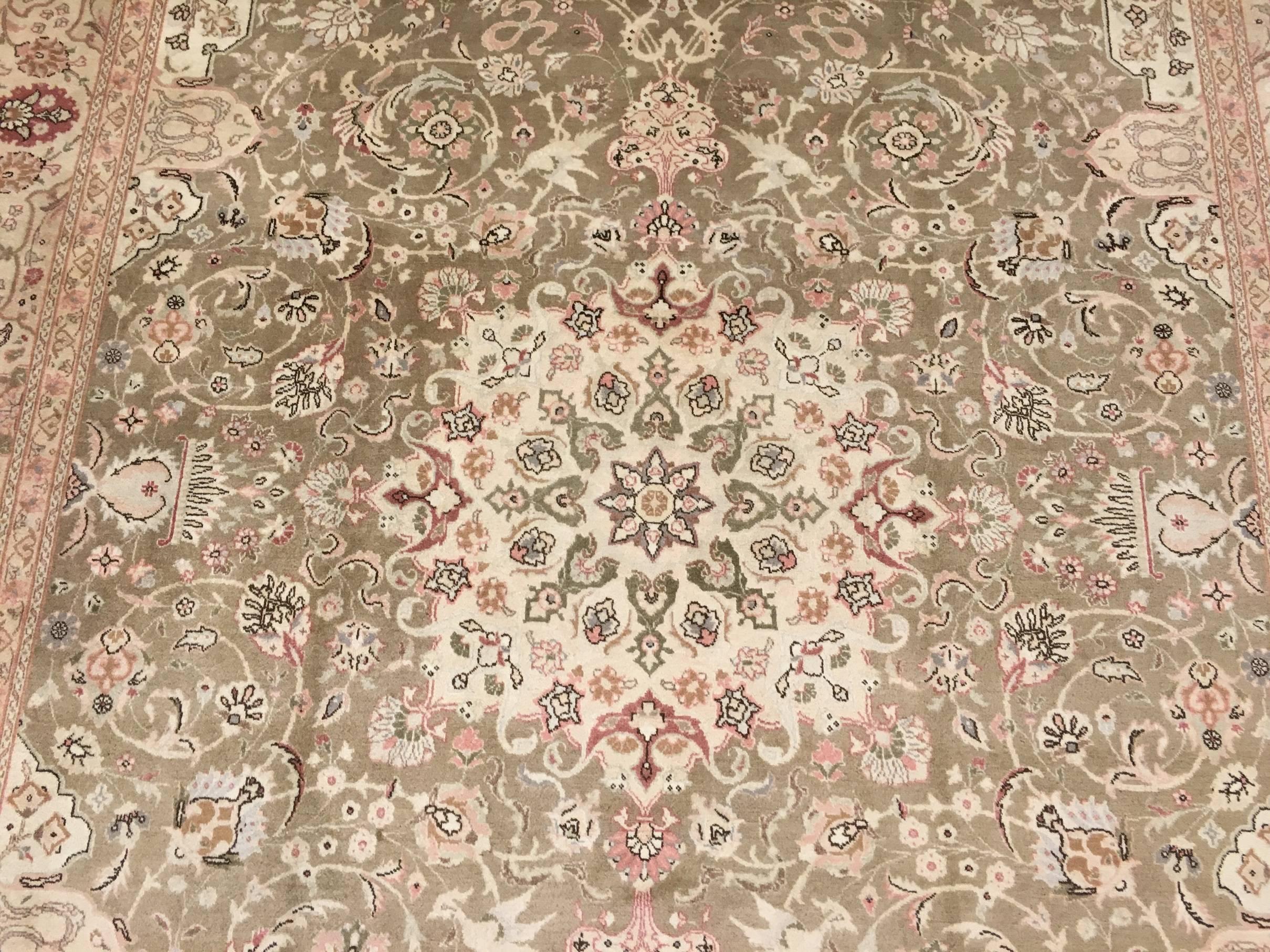 This is a Persian Tabriz handwoven circa 1930-1940 by master weavers in Iran in the city of Tabriz. The weaver has put attention to colors and detail thus making this a very tight weave. This rug is what is better know as a 50 Raj weave. The