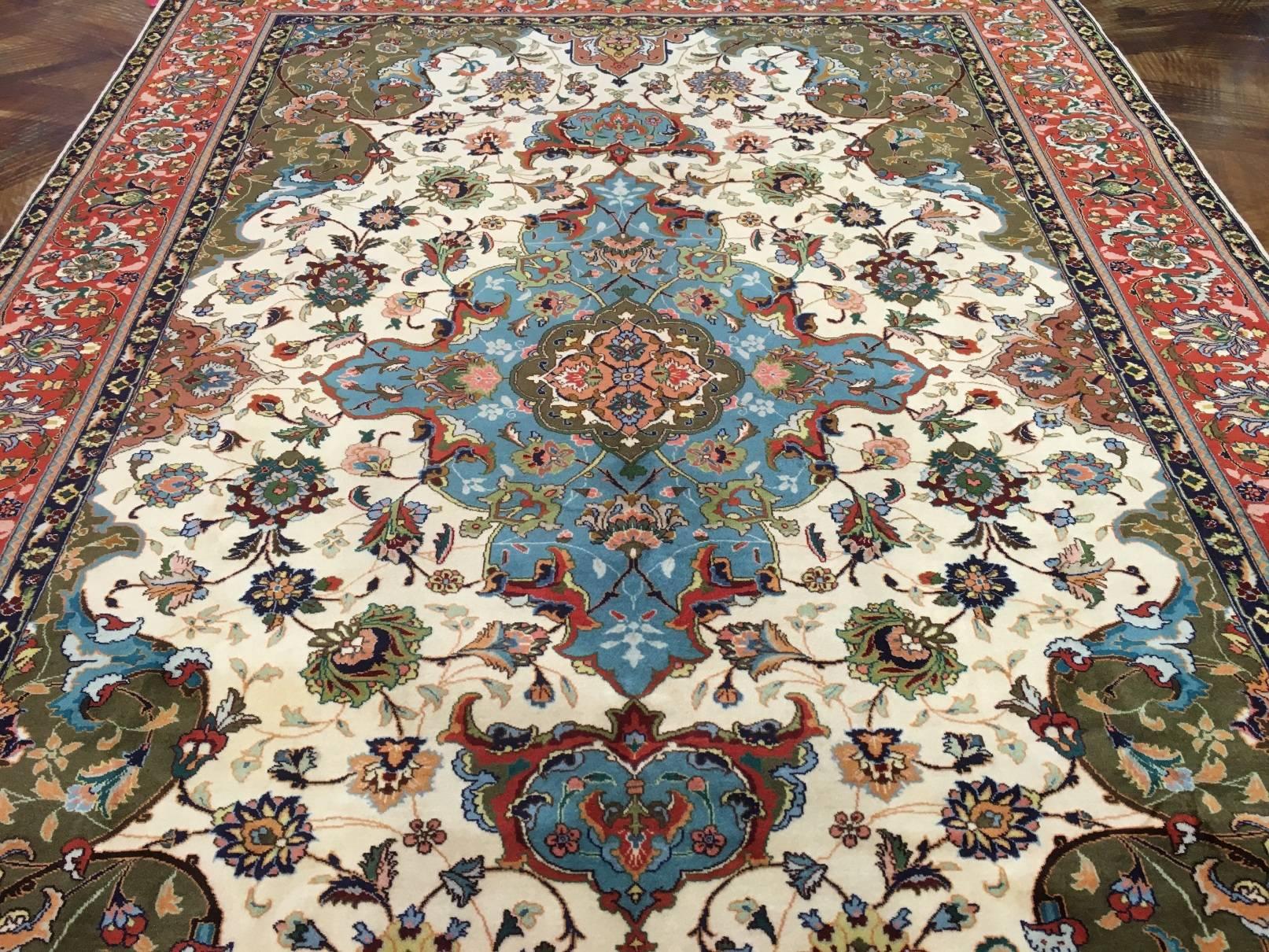 This is a Persian Tabriz handwoven circa 1930-1940 by master weavers in Iran in the city of Tabriz. The weaver has put attention to colors and detail thus making this a very tight weave. This rug is what is better know as a 50 Raj weave. The