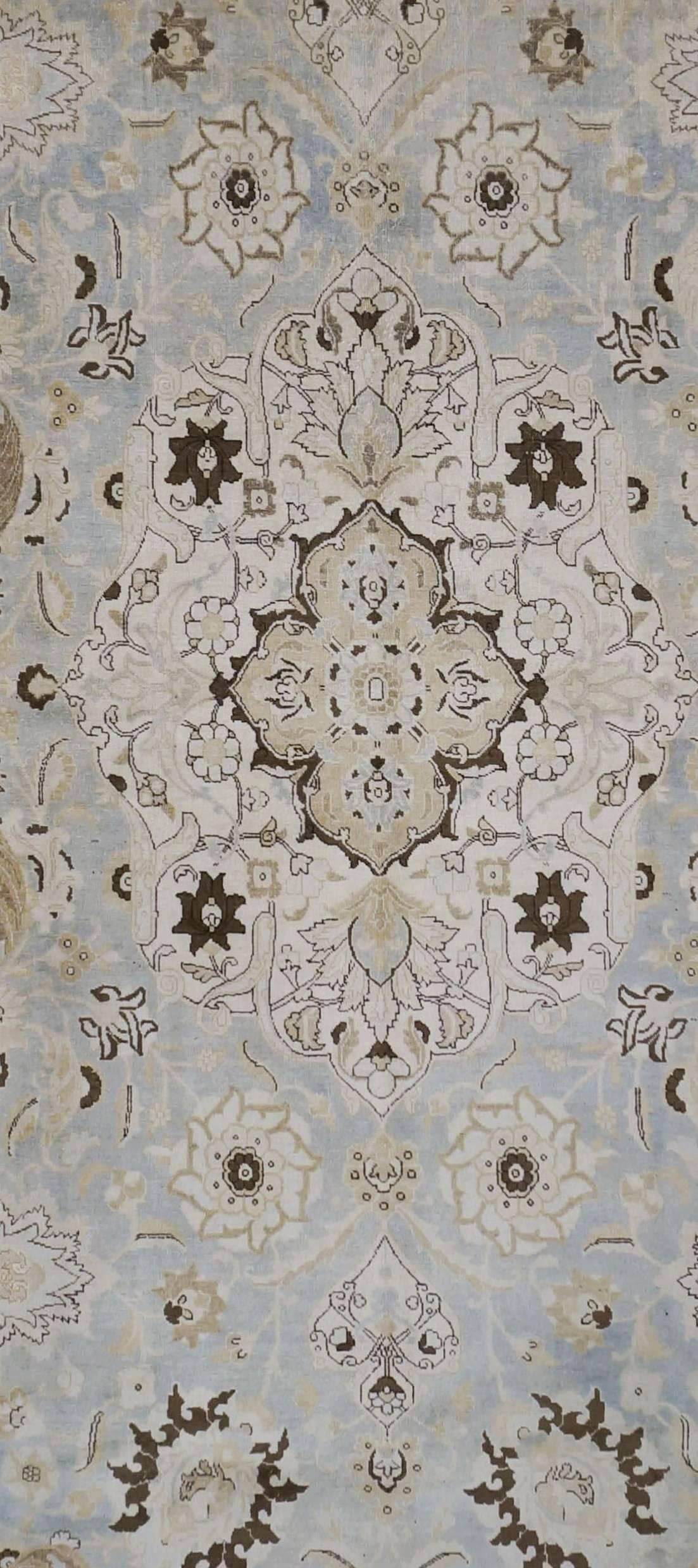 Persian Tabriz woven in late 1800s central medallion with very soft colors and an even pile. The condition is excellent for its age. There are no repairs.
Size: 11.2 x 15.8.