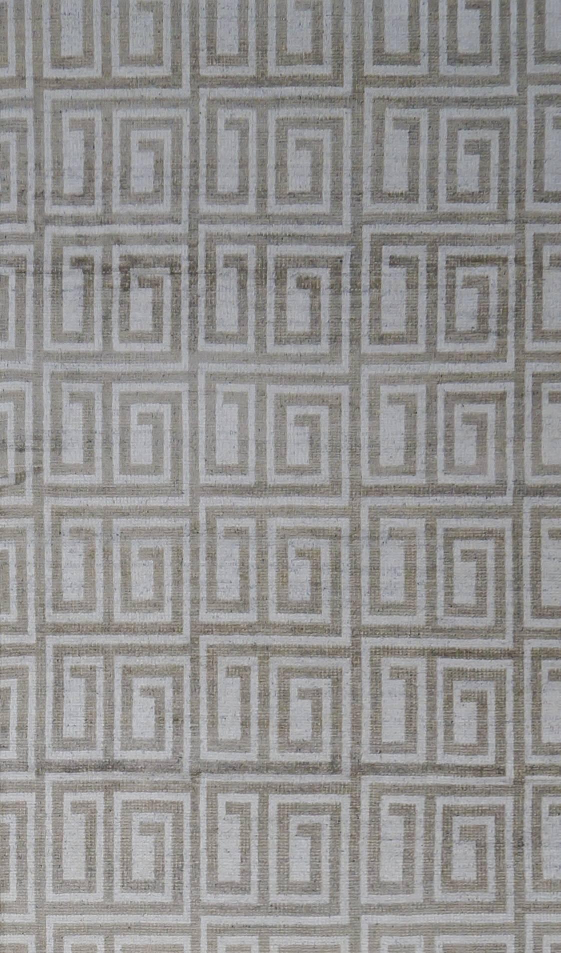 New transitional Greek key Moroccan style woven oriental rug. Woven in India with grey and white shades. The pile has been sheared low and the white accents are woven with silk.
Measures: 12.1 x 17.9.