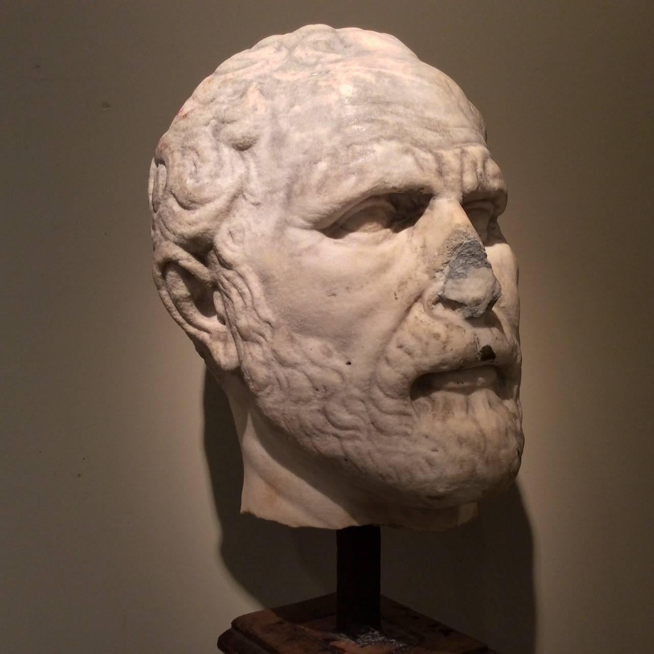 Demosthenes, head of Roman statue (marble), copy after Hellenistic original by Polyeuctos;
Demosthenes well-known Athenian statesmen was a great orator.
19th century oakwood base.
The representation of Demosthenes,famous orator was often  done by