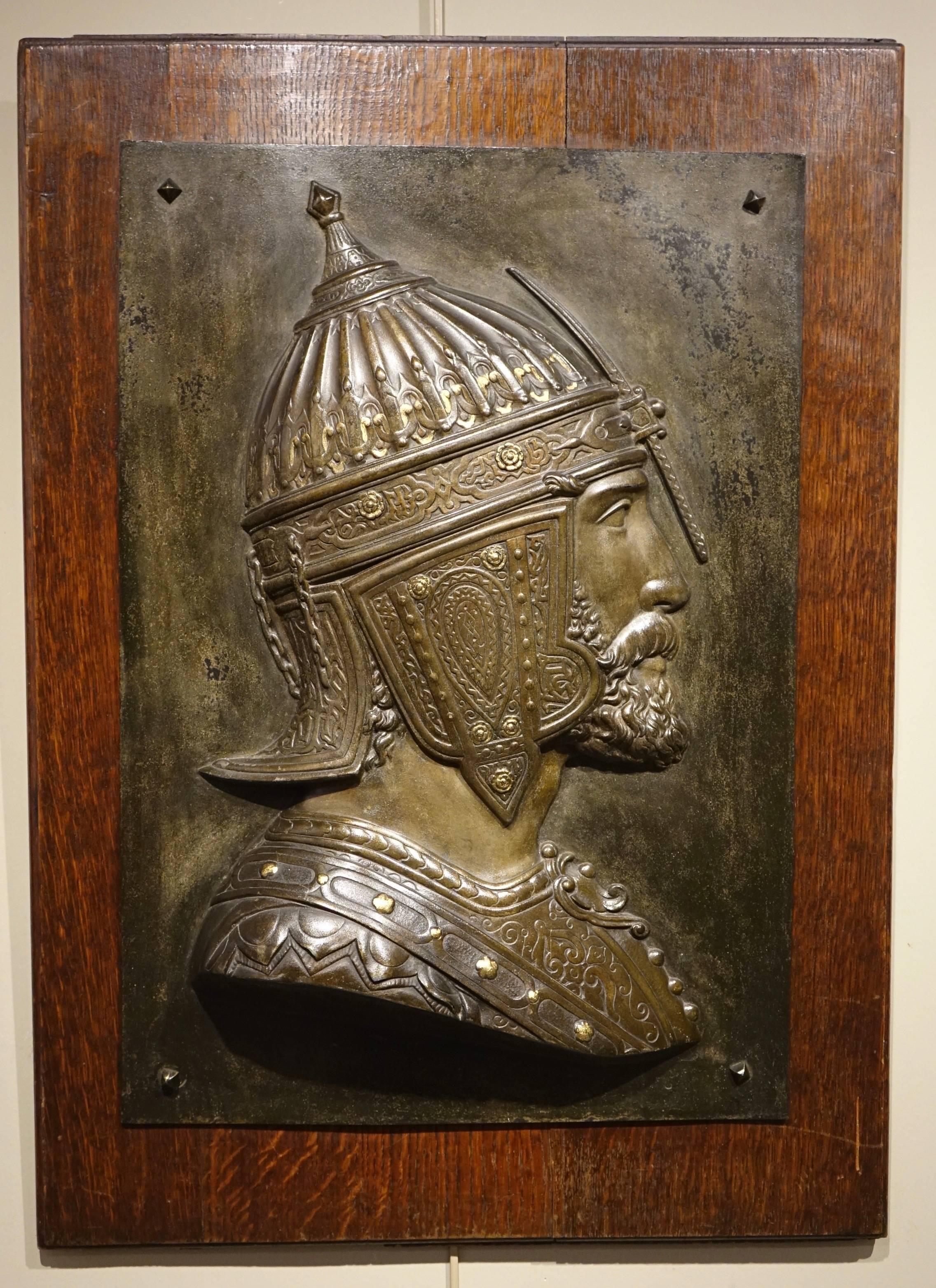 Metal Plate mounted on an oak plaque representing a Qadjar warrior seen in profile. Beautiful patina bronze with traces of gilding (or golden paint). 
Signed D. Lenoir (we had a counterpart on which the signature was more legible) from the Lenoir