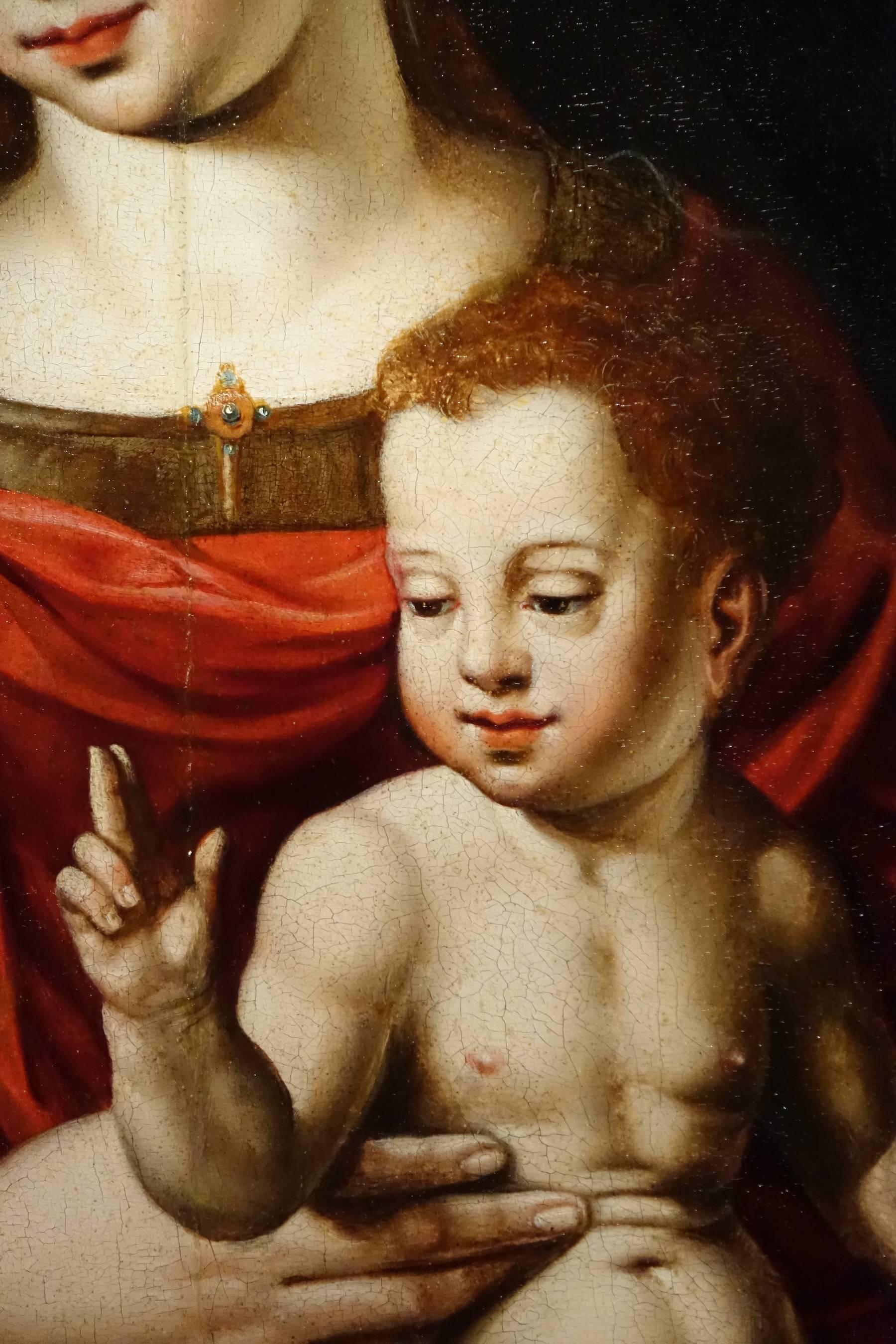 "Virgin and Child oil on panel, Flanders, 16th century"
Oil on oak panel depicting the Virgin and Child on his lap, the latter looking at Saint John Bapitist, placed on the lower left. Downstairs on an entablature two dishes in pewter;