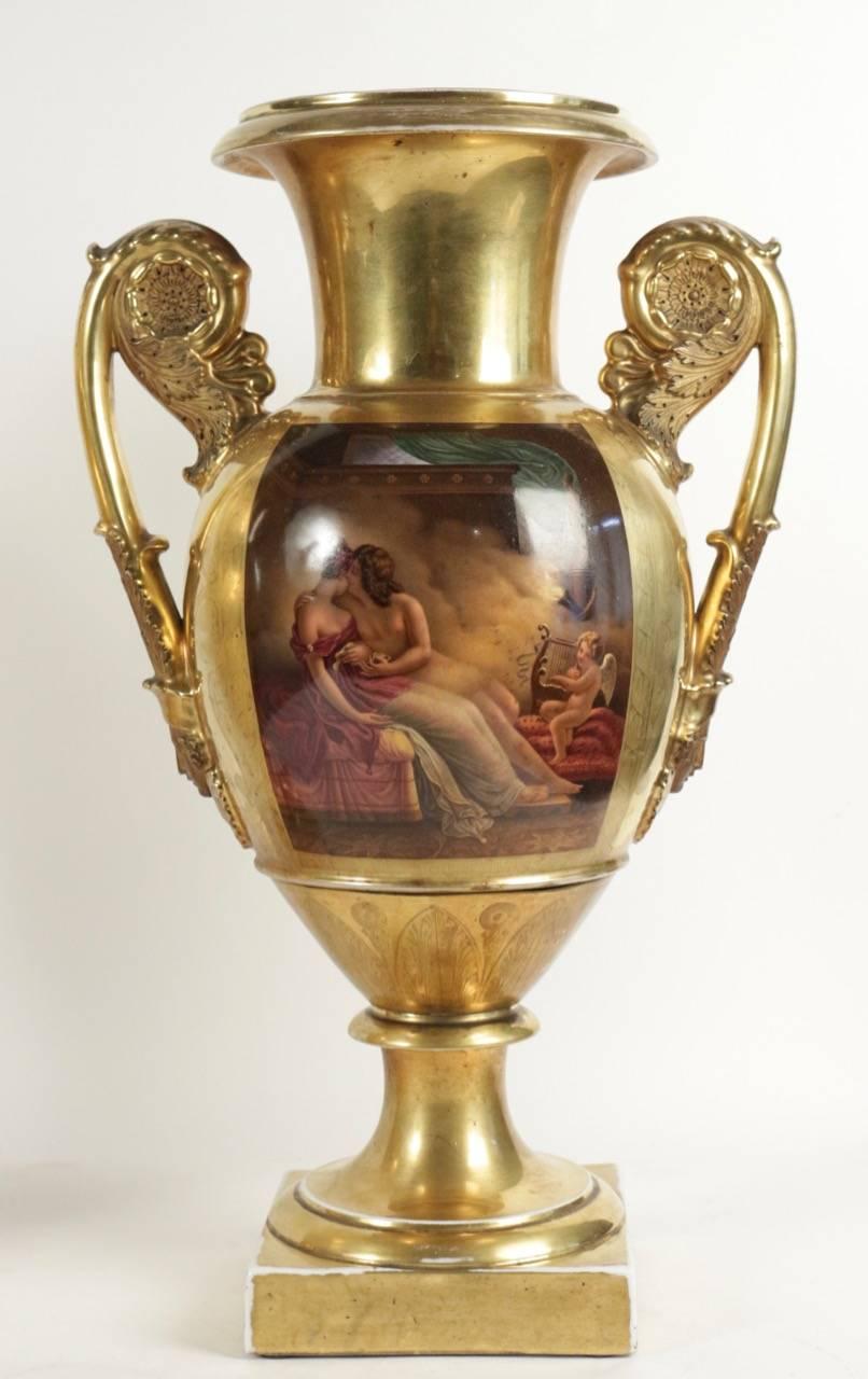 A pair of polychrome and gilt porcelain de Paris vases with two handles decorated with medallions. 
The body of the vases is ornamented with two polychrome cartouches representing paintings of Anne-Louis Girodet-Trioson, 1767-1824.
 Anne-Louis