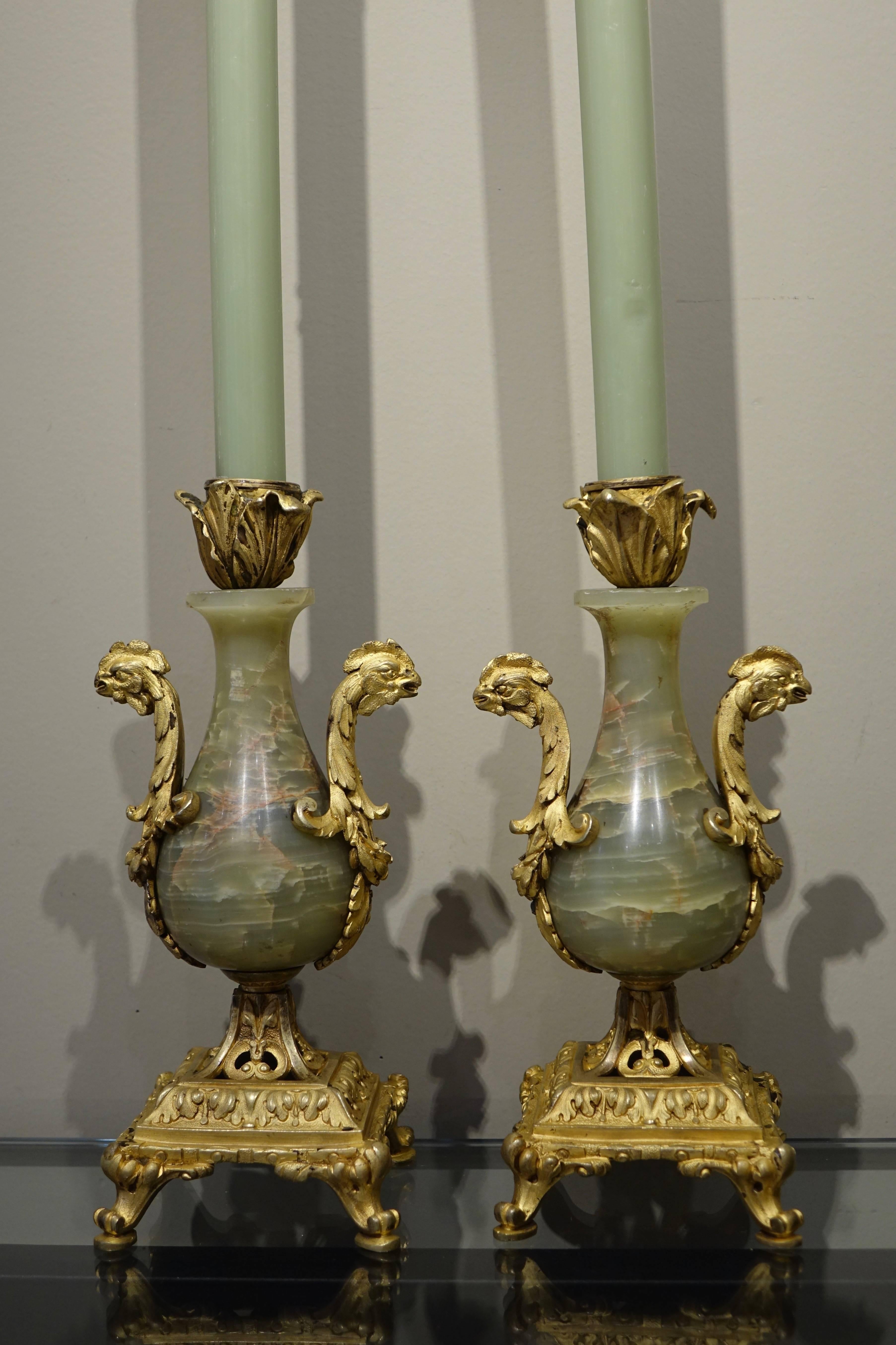 Pair of candlesticks in bronze and onyx, handles in shape of a rooster, France, circa 1870.
     