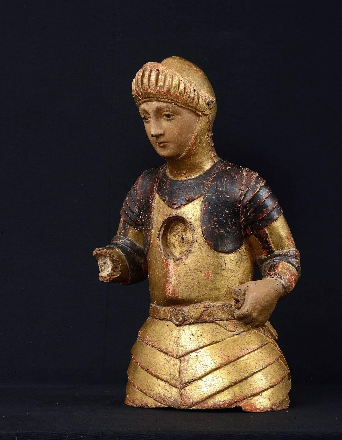Reliquary bust of Saint George carved wood in the round, gilded and polychrome.
Tuscany, Siena, attributed to Francesco di Valdambrino, (circa 1363 - Siena, 1435),
first half of the 15th century.Reliquary bust of St. George carved and gilded wood.