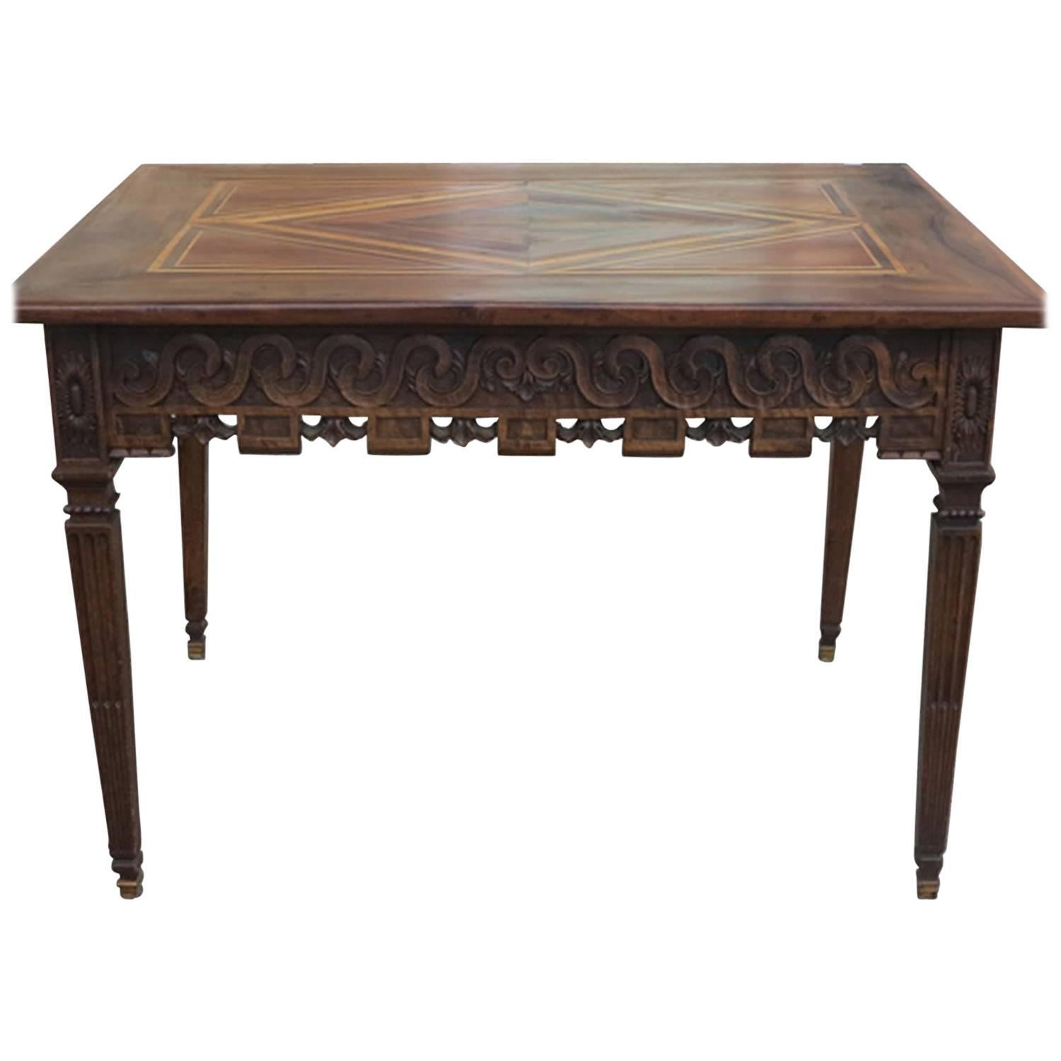 Unique Louis XVI table, beautifully carved apron and legs, the top with a stunning rhombus veneer decor. Two drawers. A combination of walnut and elm. In excellent condition. 
Beautiful example of a provincial Louis XVI table which combines a